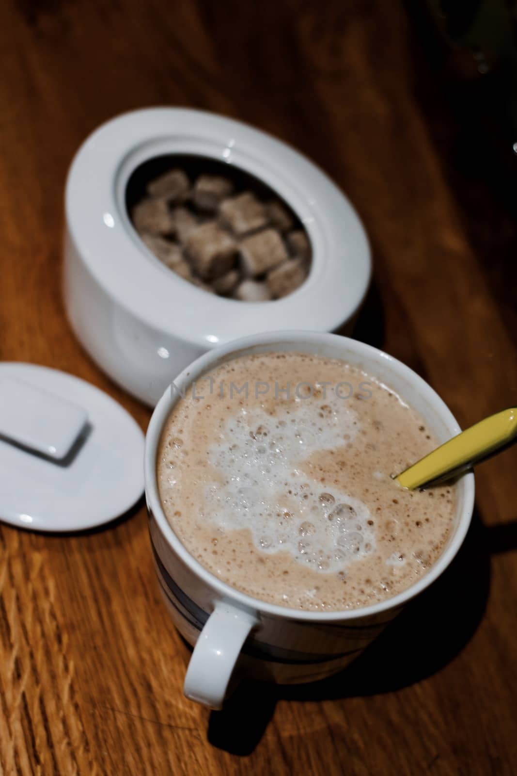 Fresh and tasty coffee in the kitchen on the wooden board. Drink concept.