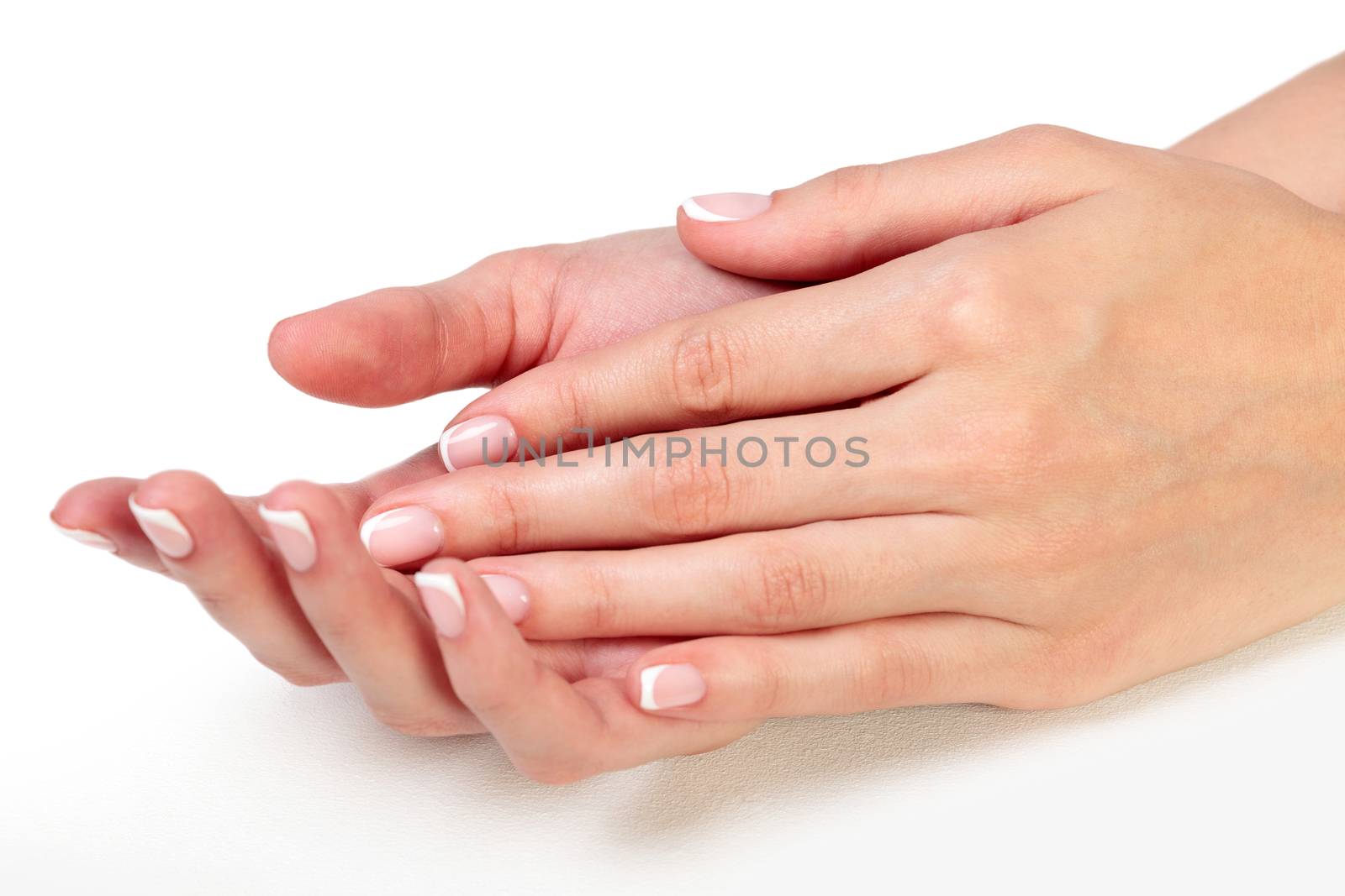 Closeup shot of beautiful female hands. Fingers with french mani by Nobilior