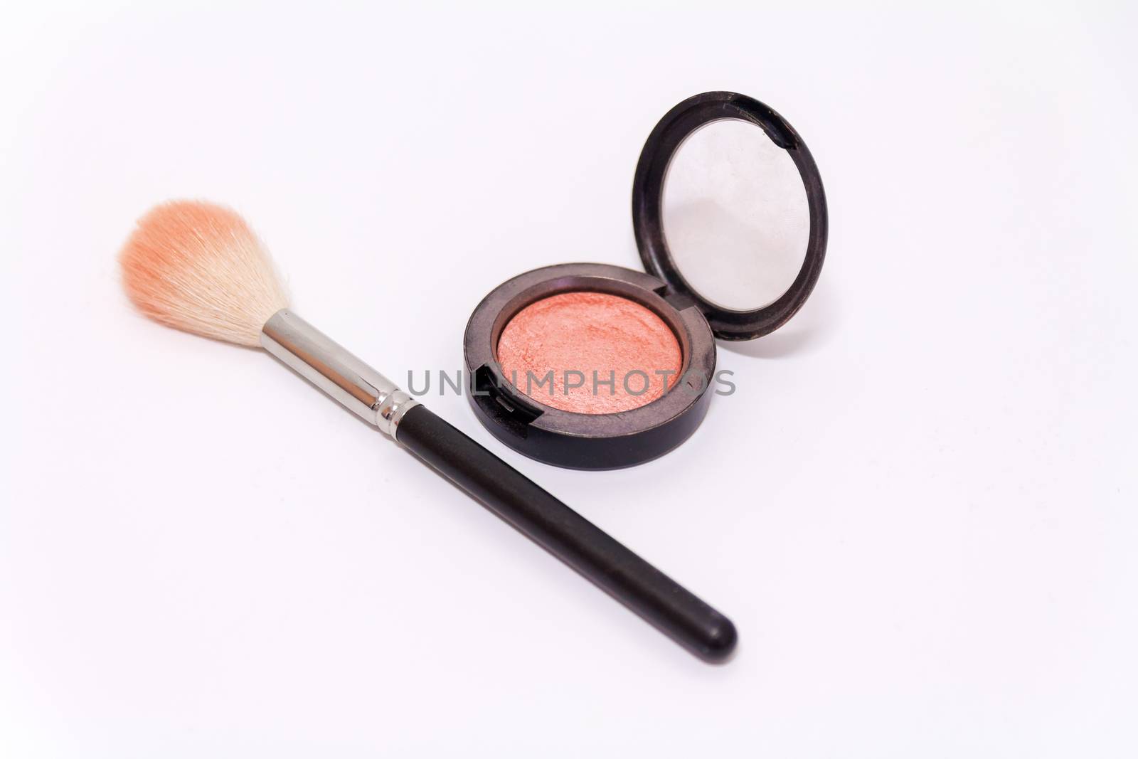 Close up of makeup brush and blush box isolated on white backgro by wavemovies