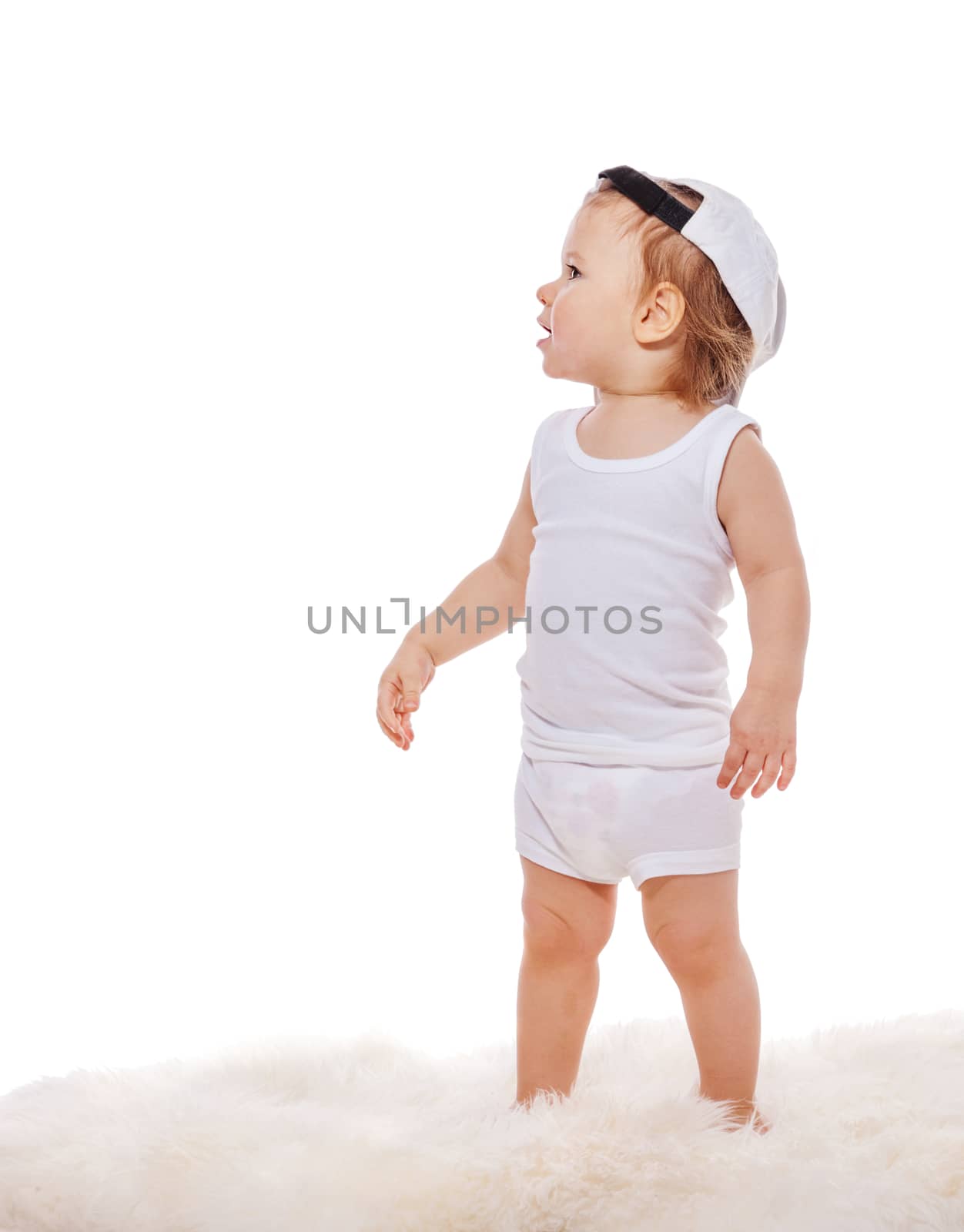 Happy child little boy running isolated over a white