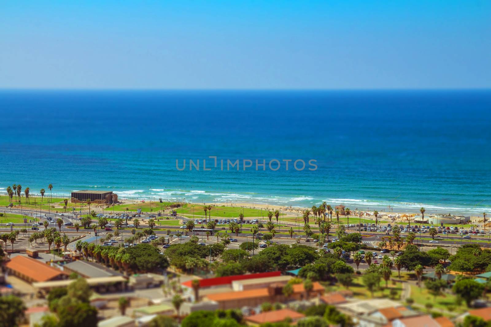 Aerial view of Tel Aviv promenade. Recognized places such as the Etzel Museum, Tel Aviv beach and Neve Tzedek neighborhood. Tilt shift.