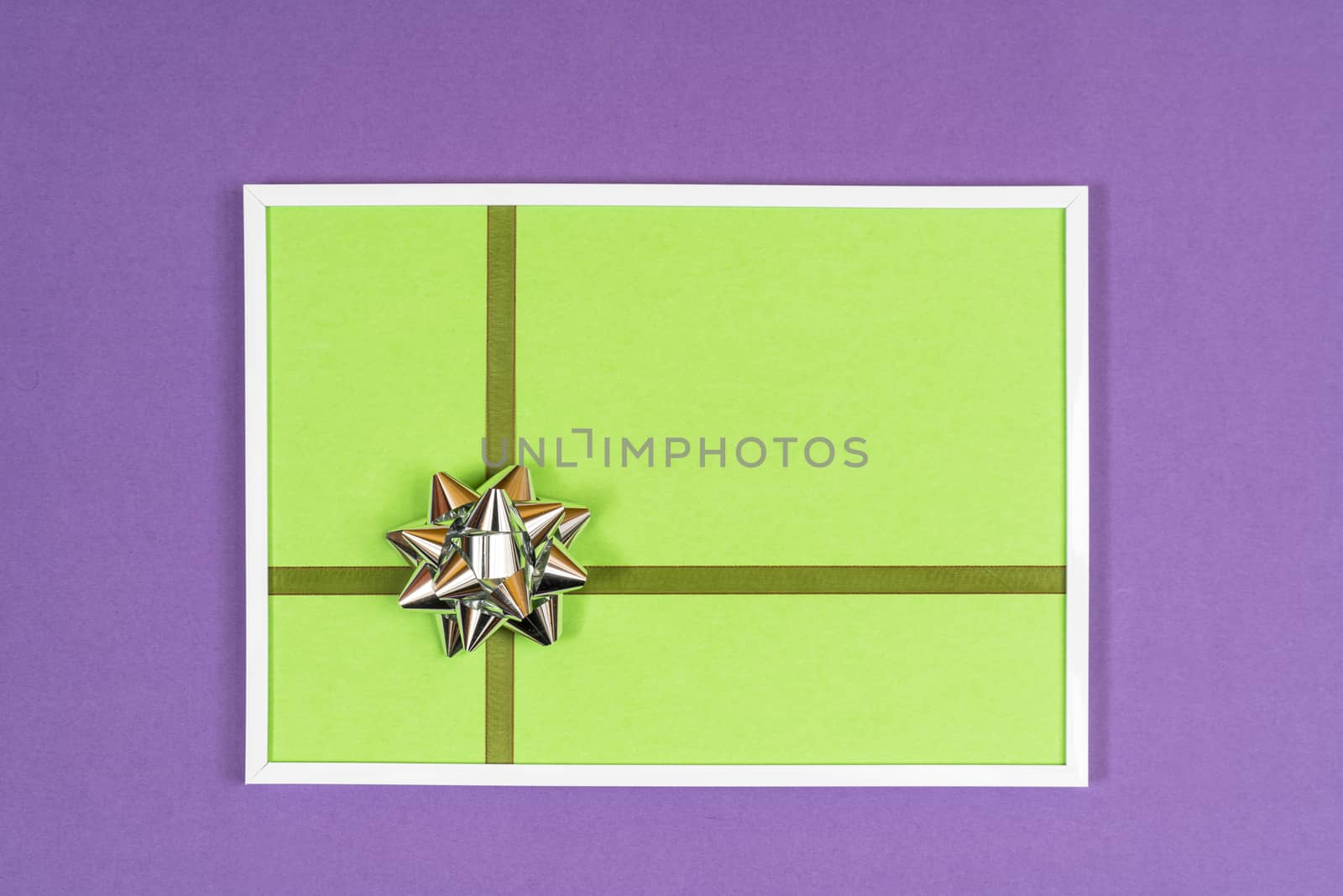 decorative bow in a white frame on a colored background