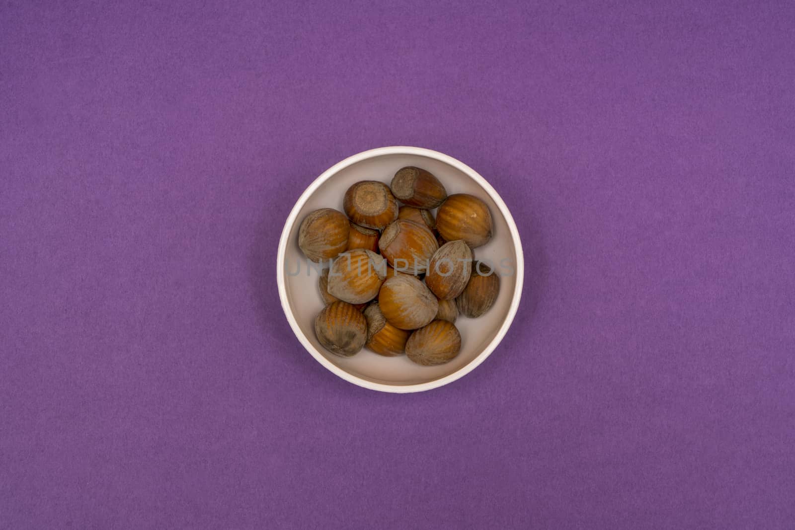 hazelnuts in a bowl by sergiodv