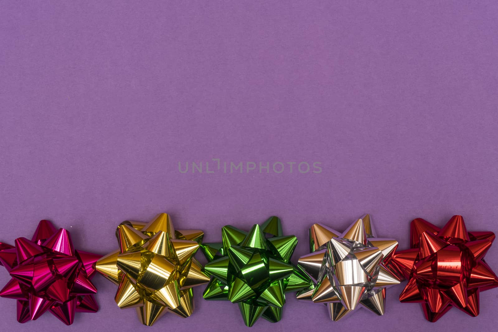 row of colored bows on a colored background
