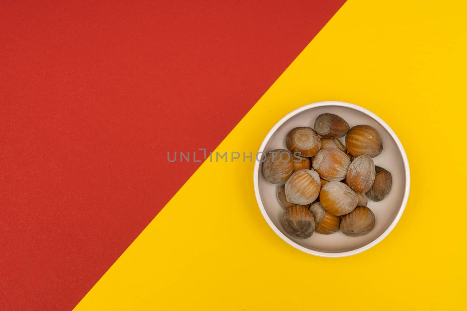 hazelnuts in a bowl by sergiodv