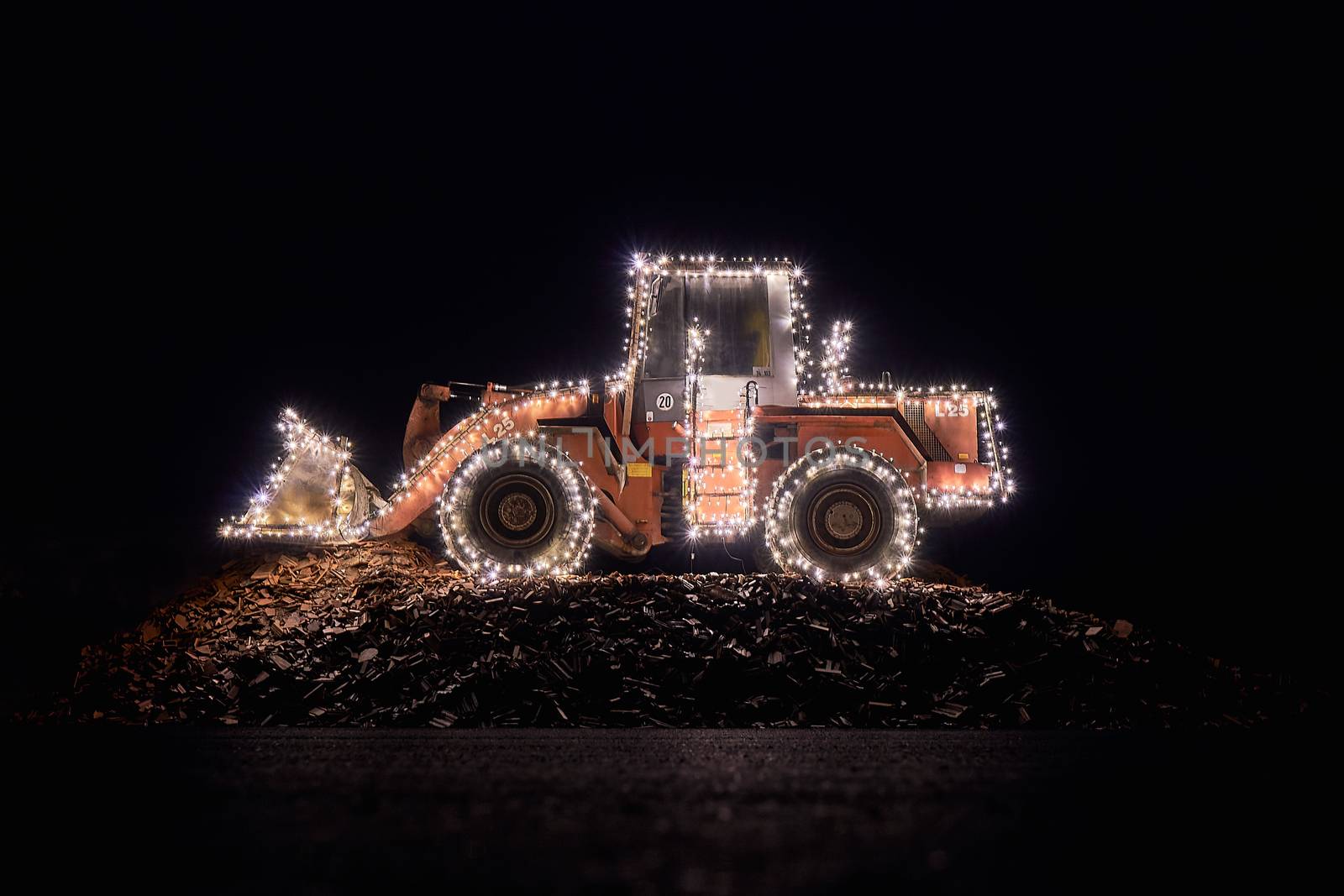 Blurred wheel loader decorated with lights bokeh lights on a wheel loader