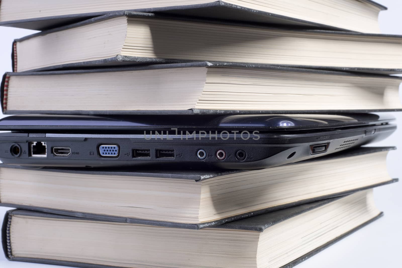 a laptop between the books