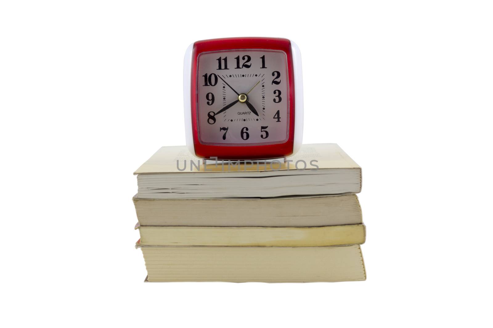 old clock with stack of books
