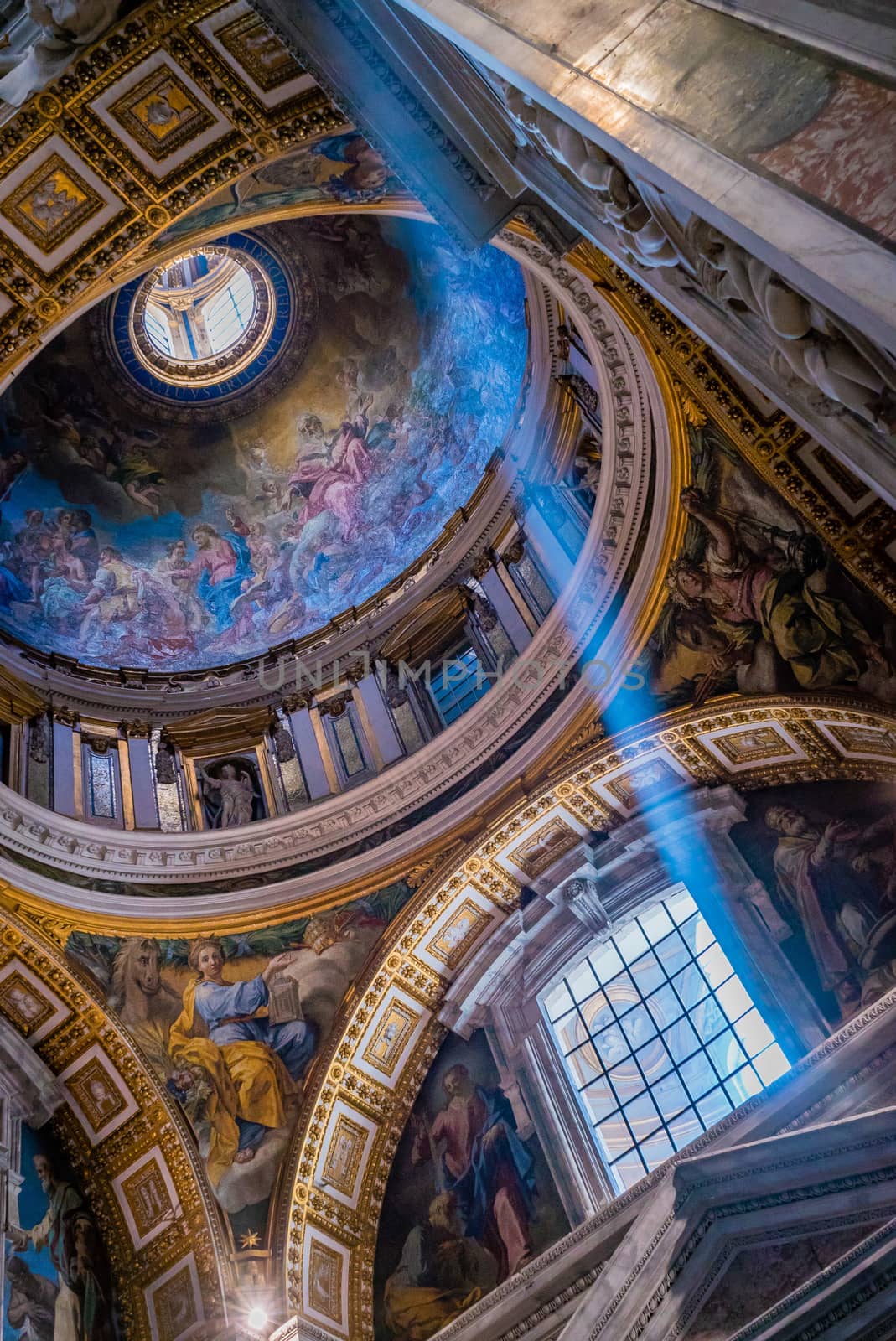 Sunray from the window of the St Peter basilica church in Rome