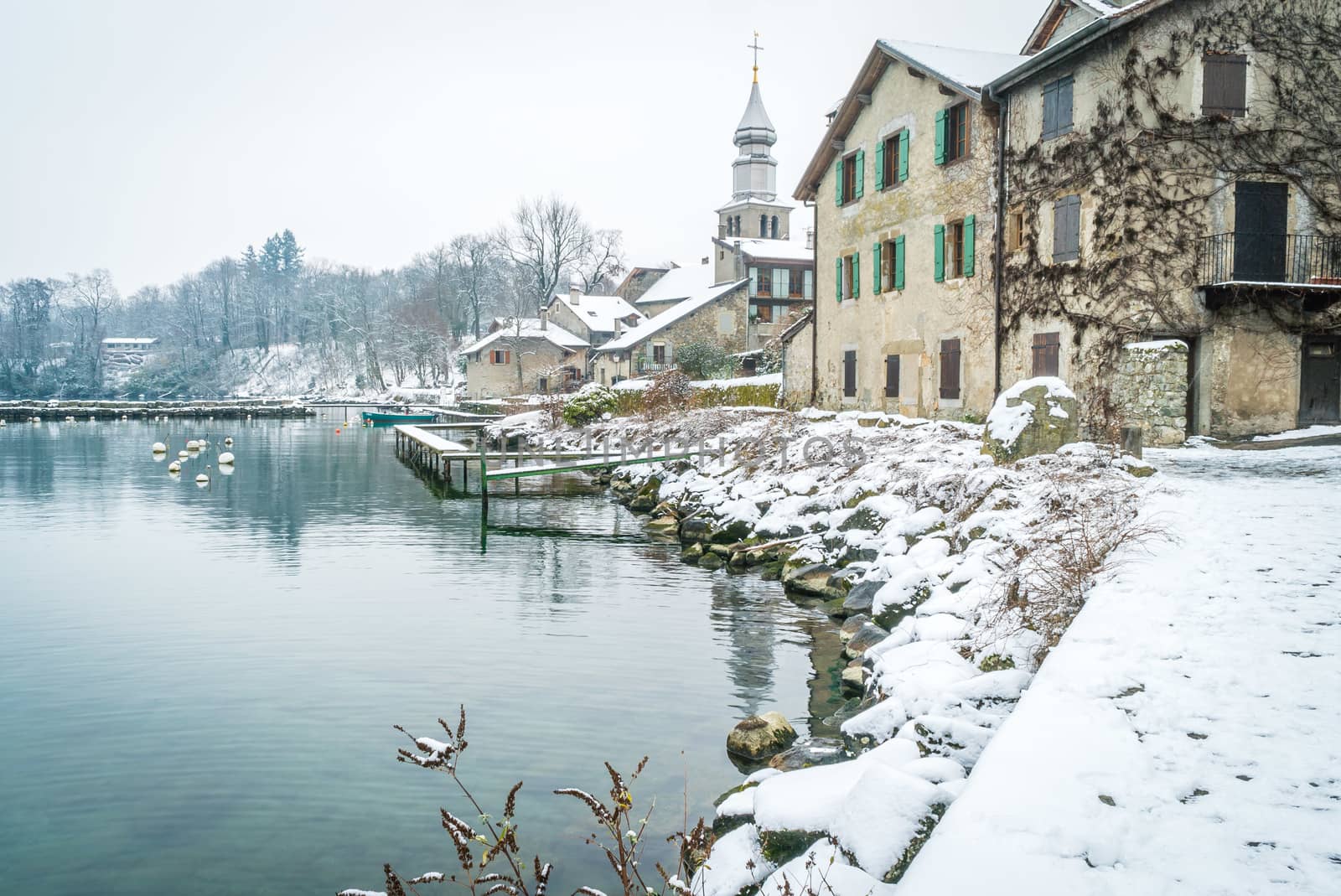 Yvoire village with snow in the winter in France