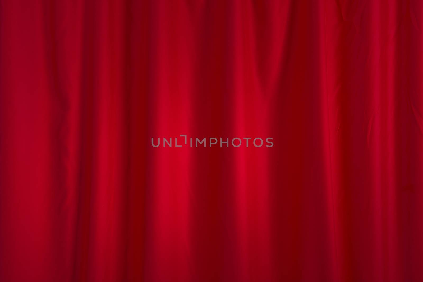 a red curtain in the background