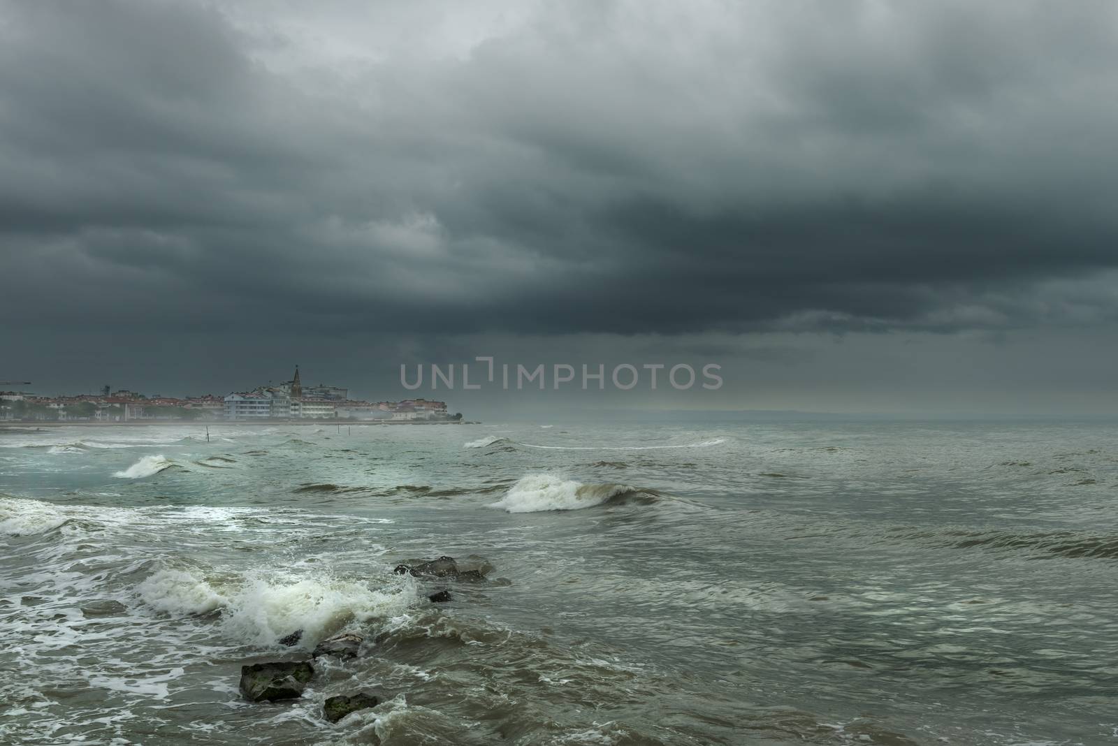 the beach with the rough sea during a winter storm