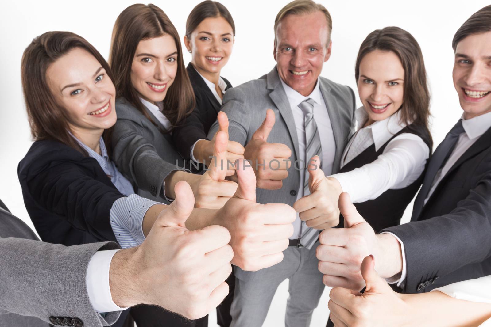 Cheering business people holding many thumbs thumbs up closeup