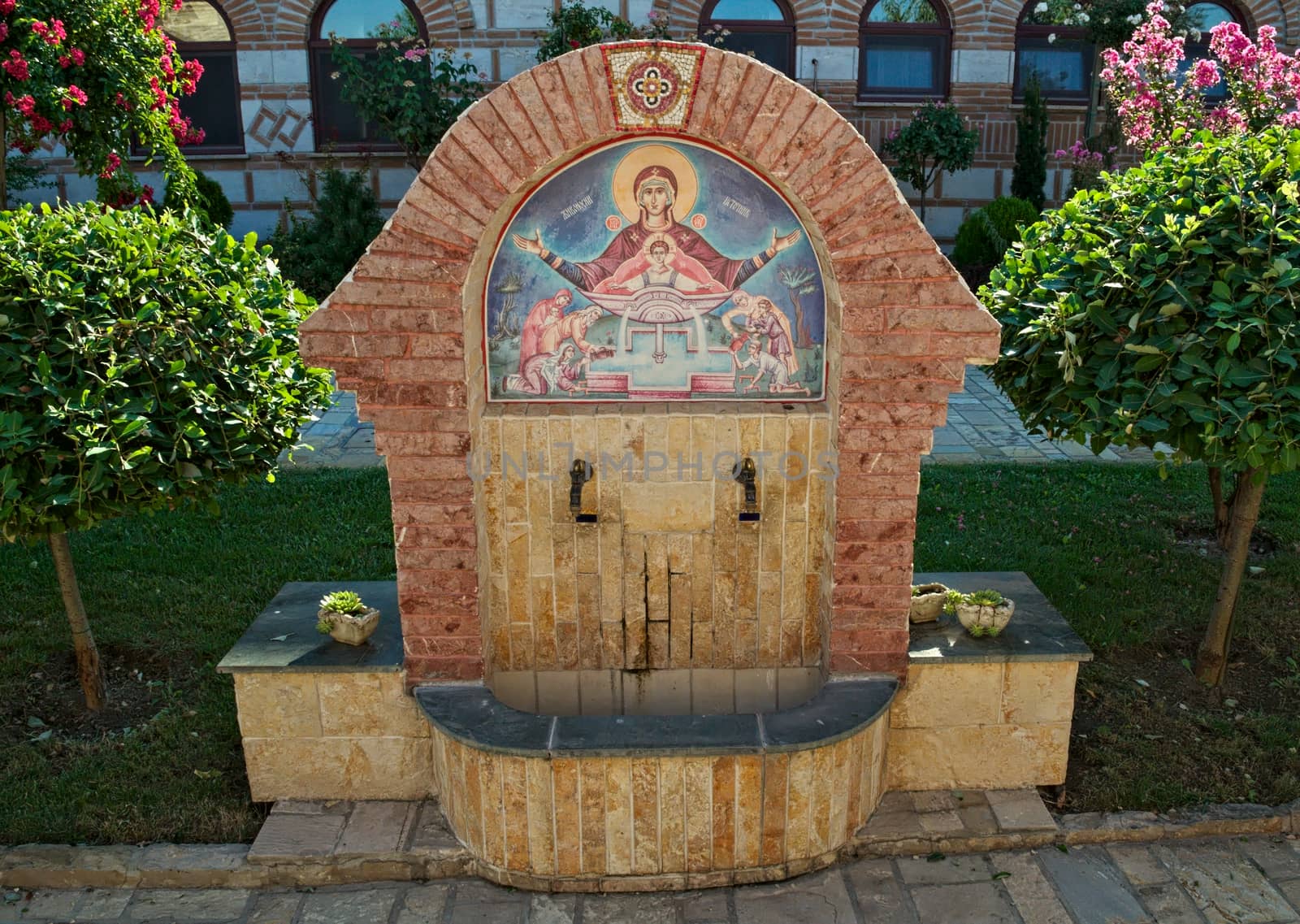 Fountain in garden of orthodox monastery in Kac, Serbia