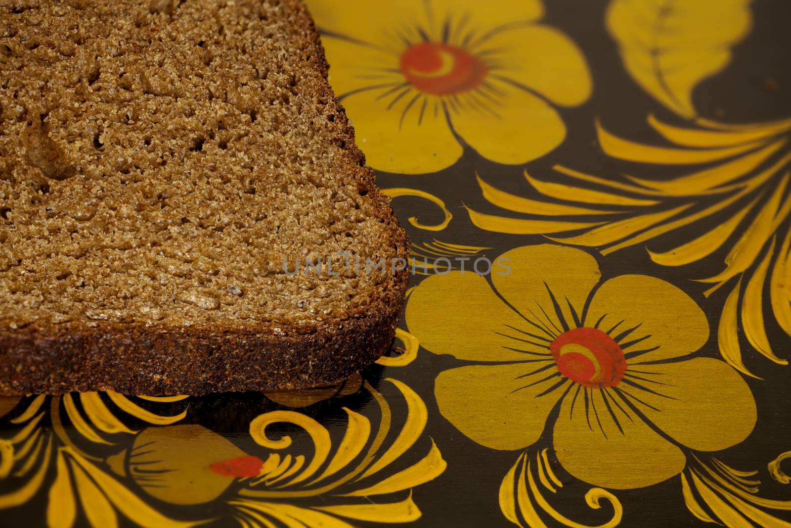 piece of rye bread on a cutting board, macro shot