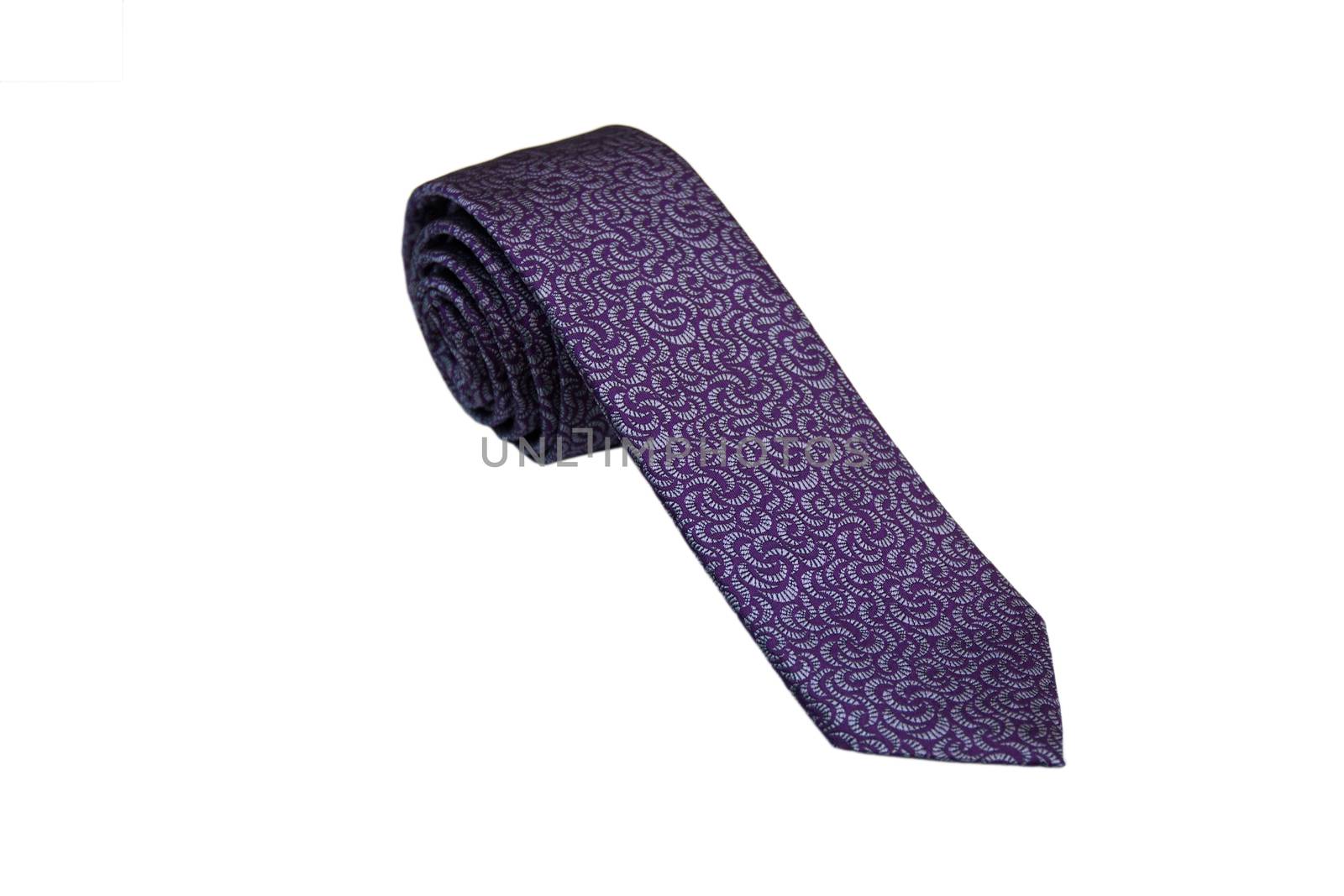 Closeup of an elegant stylish tie rolled and isolated on a white background.