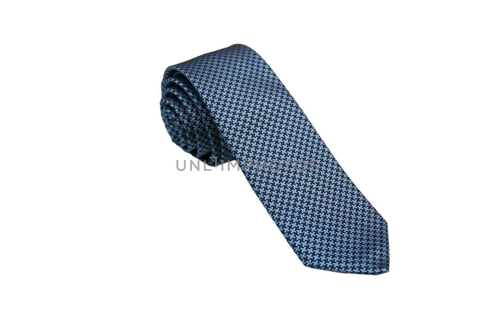 Closeup of an elegant stylish tie rolled and isolated on a white background.