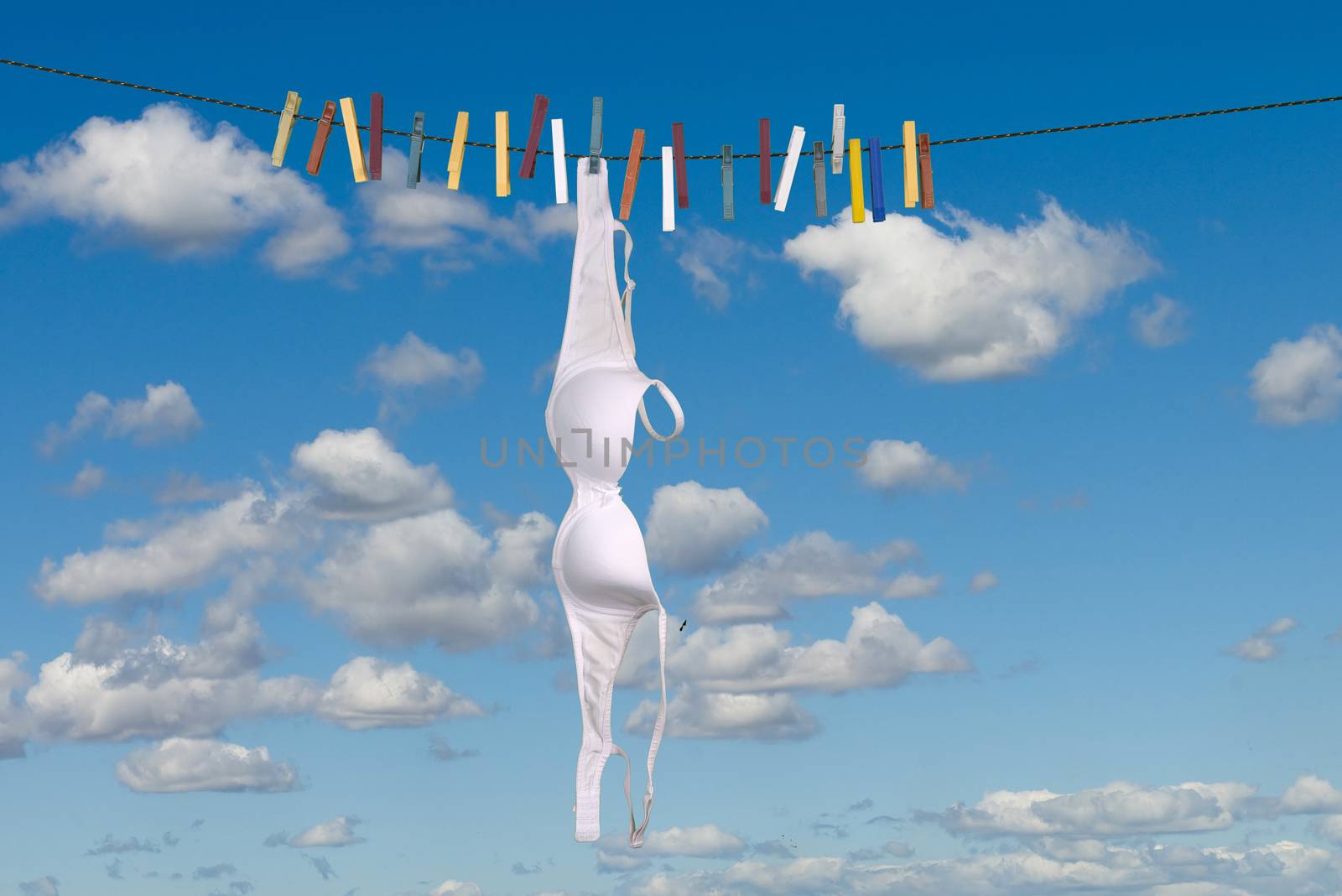 White bra hanging to dry outdoor