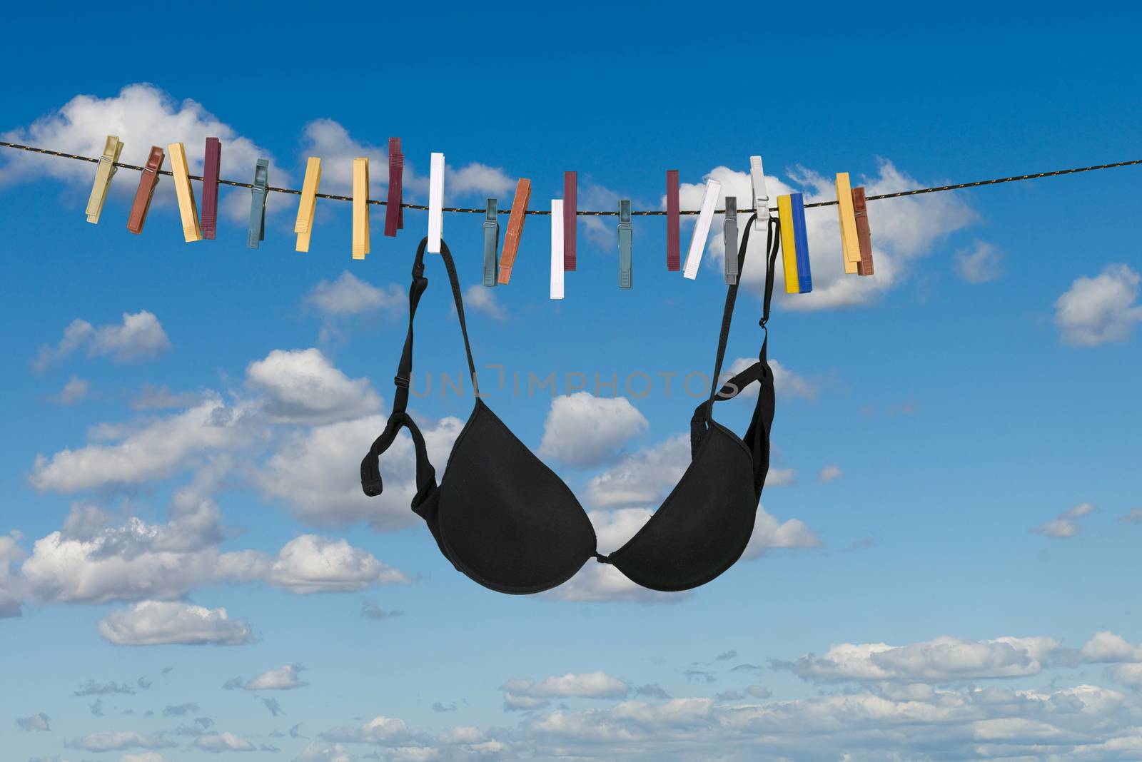 A bra hanging to dry on open air