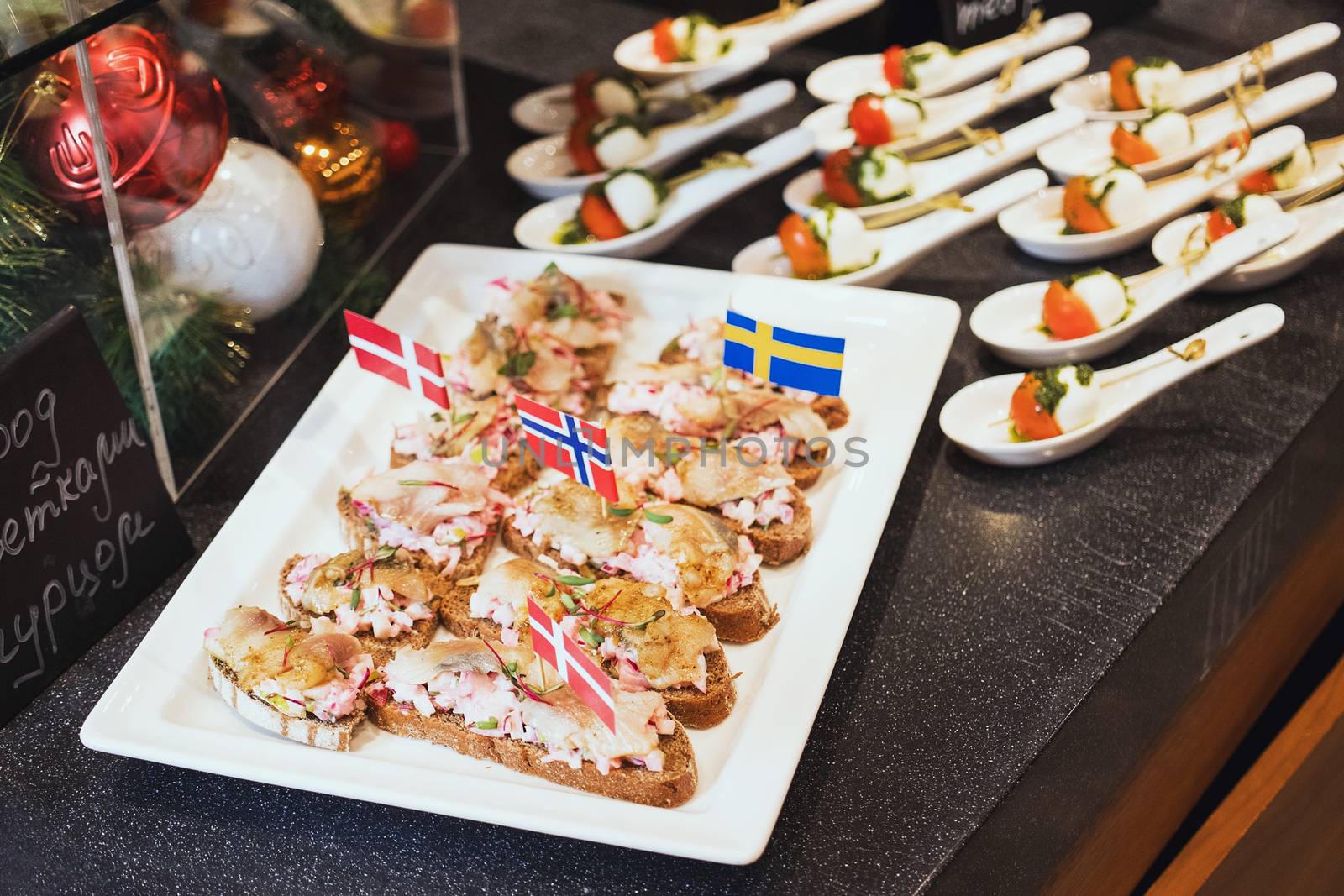 Trays with various delicious appetizer. Appetizer of fish.