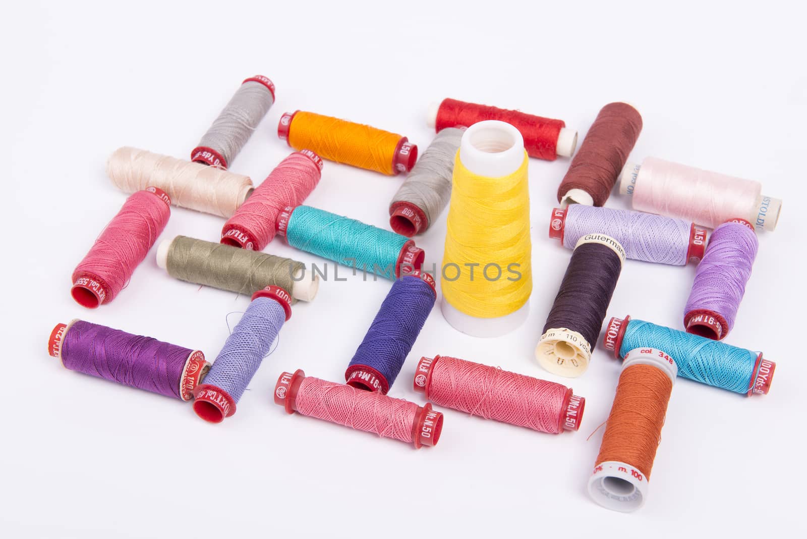 spools of sewing thread of various colors