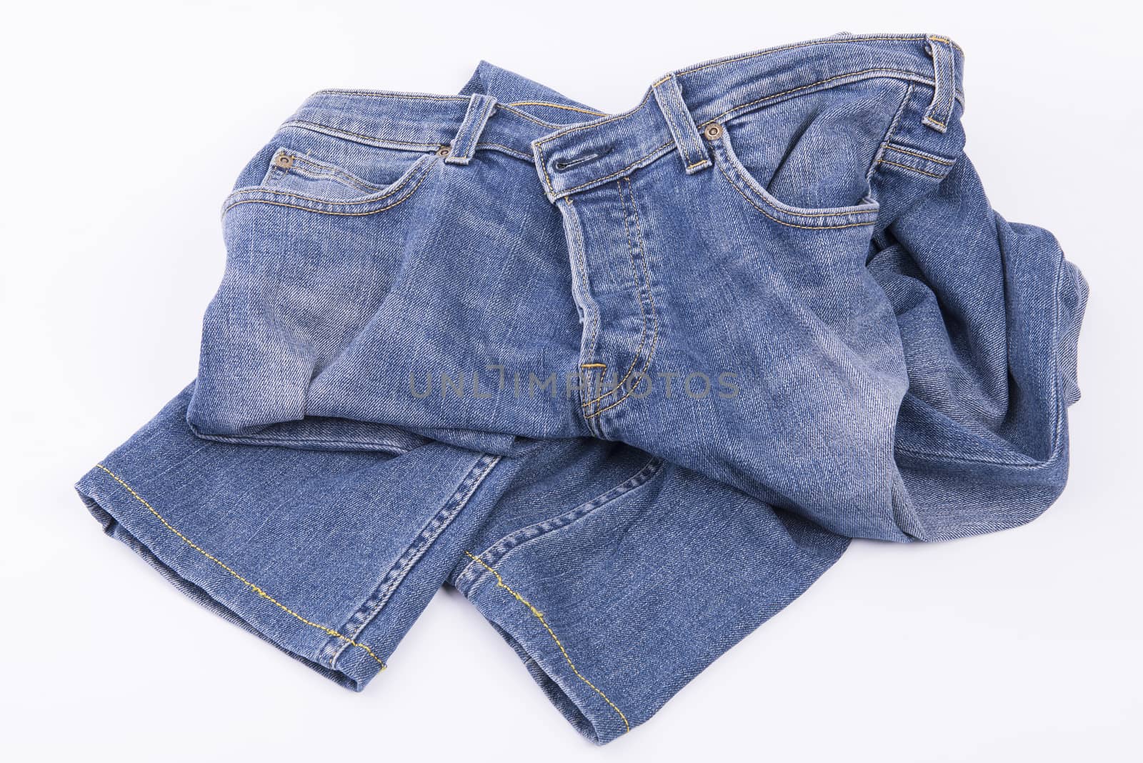 old jeans pants on a white background