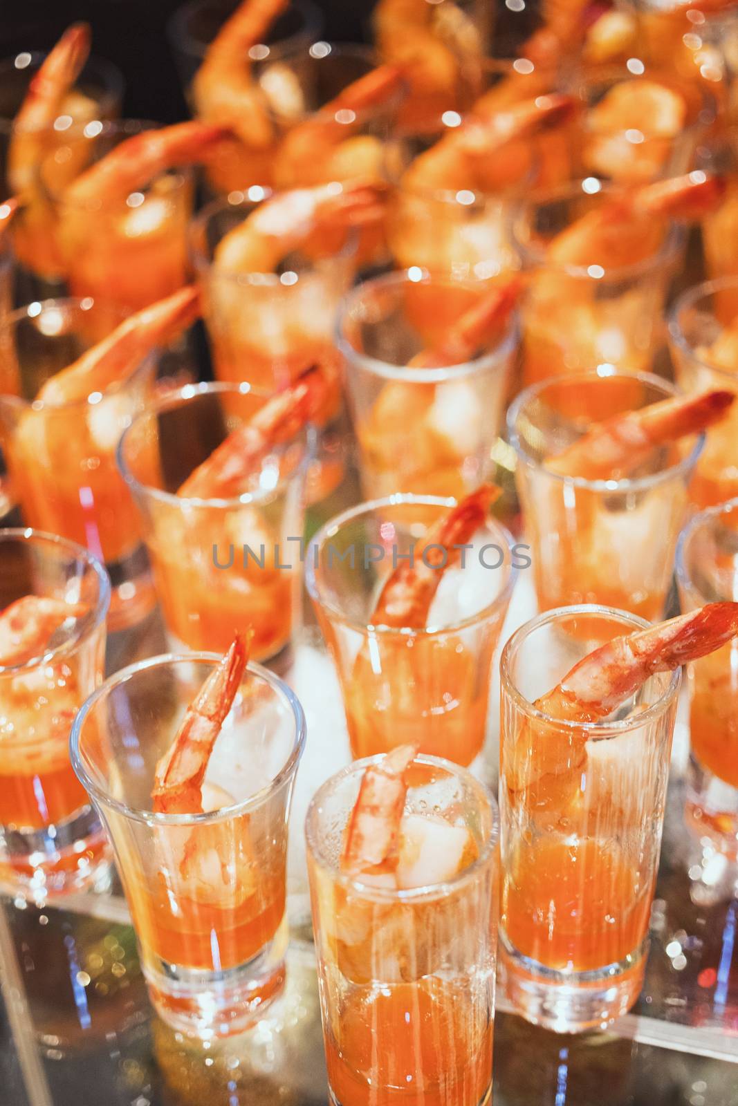 Shrimp cocktail in shot glass shot closeup by 3KStudio