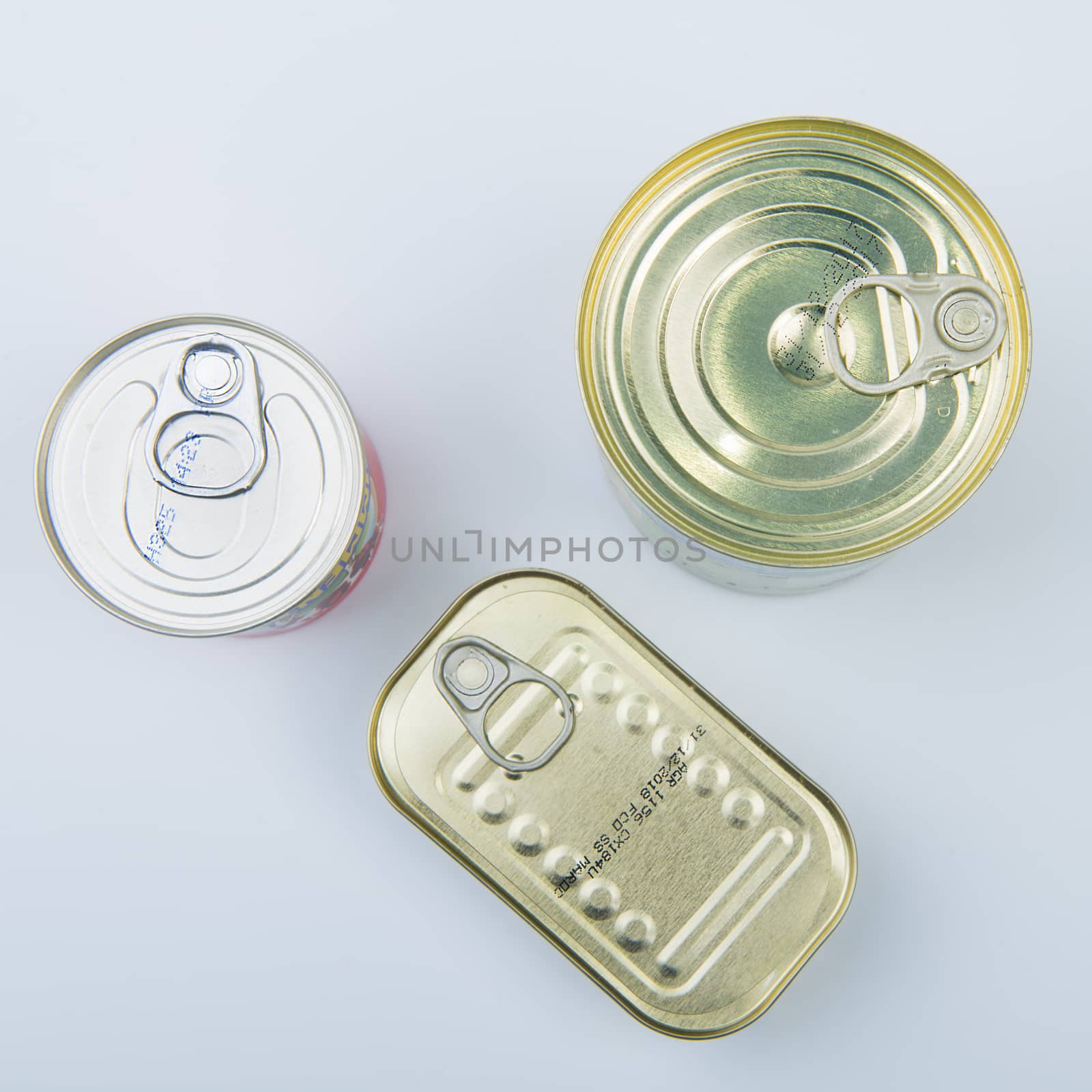 some cans on a white table