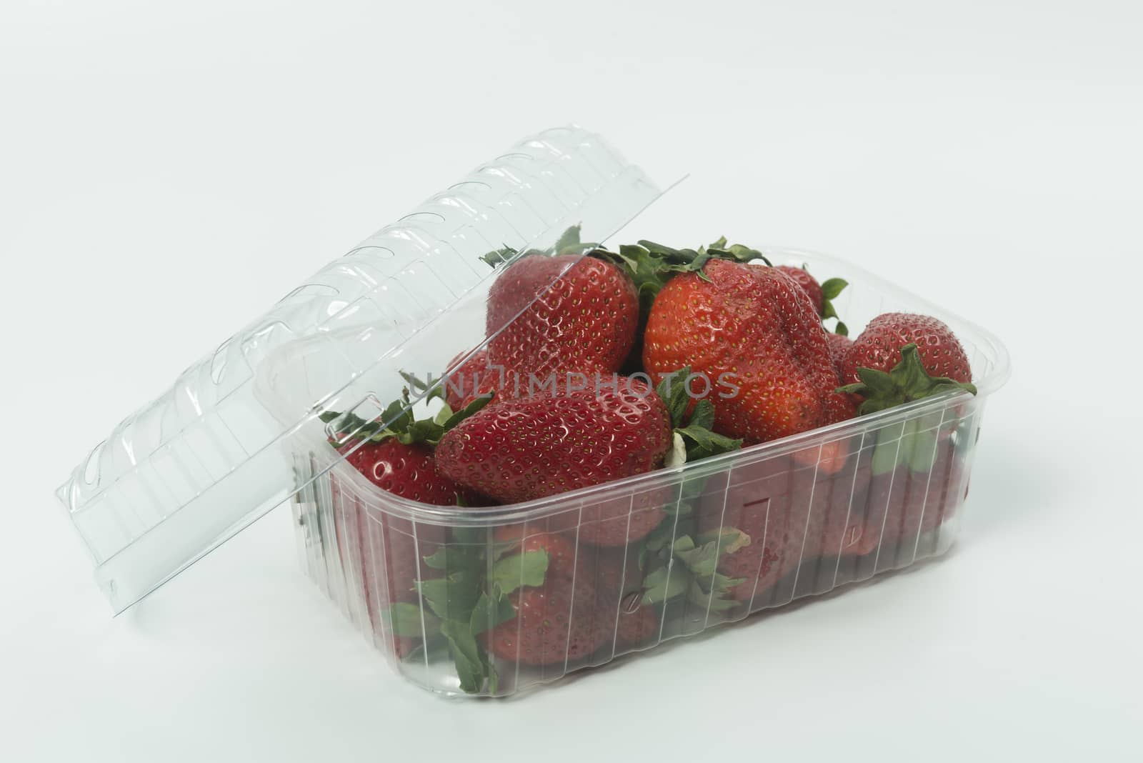 strawberries in a plastic pan