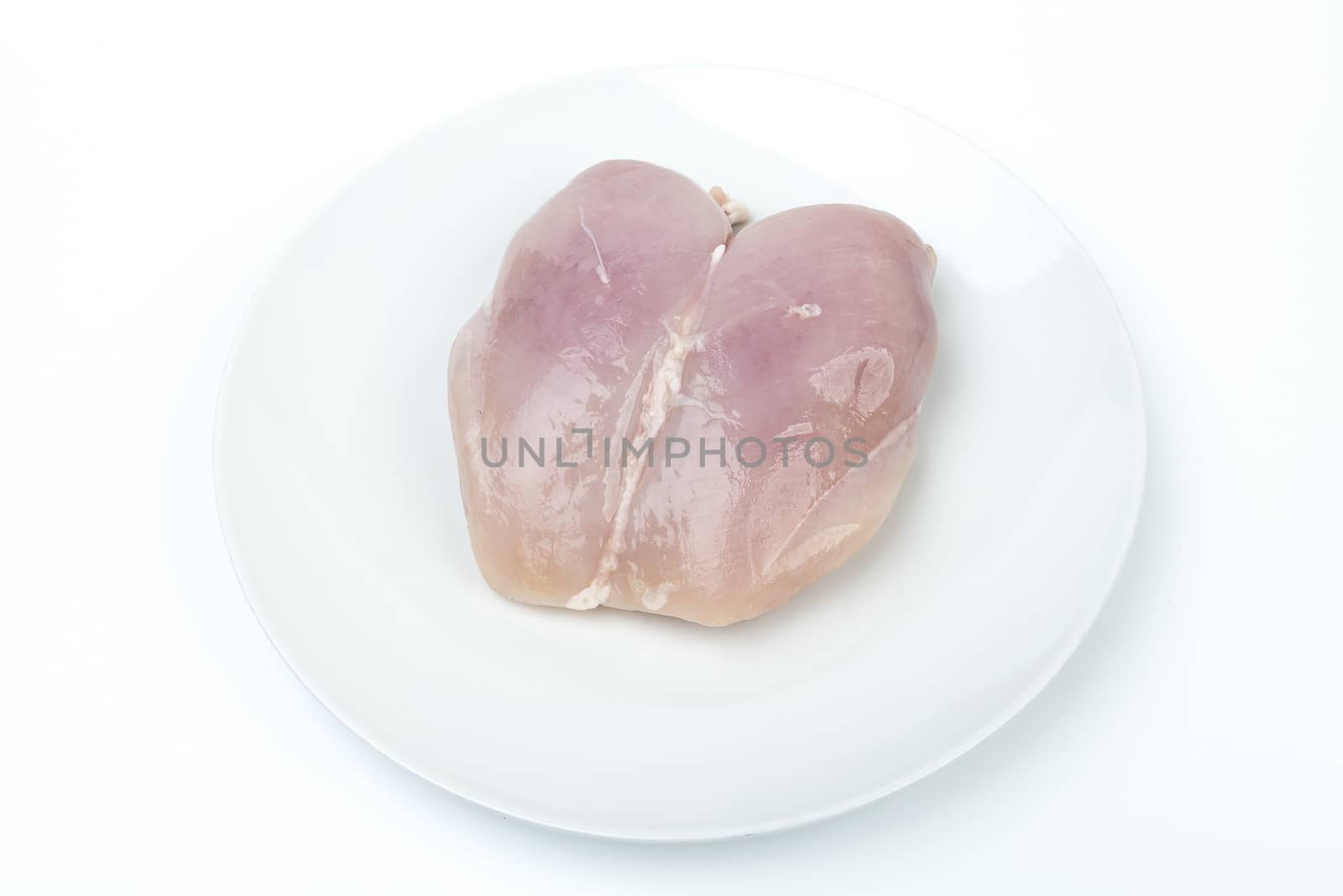 a chicken breast on a white dish