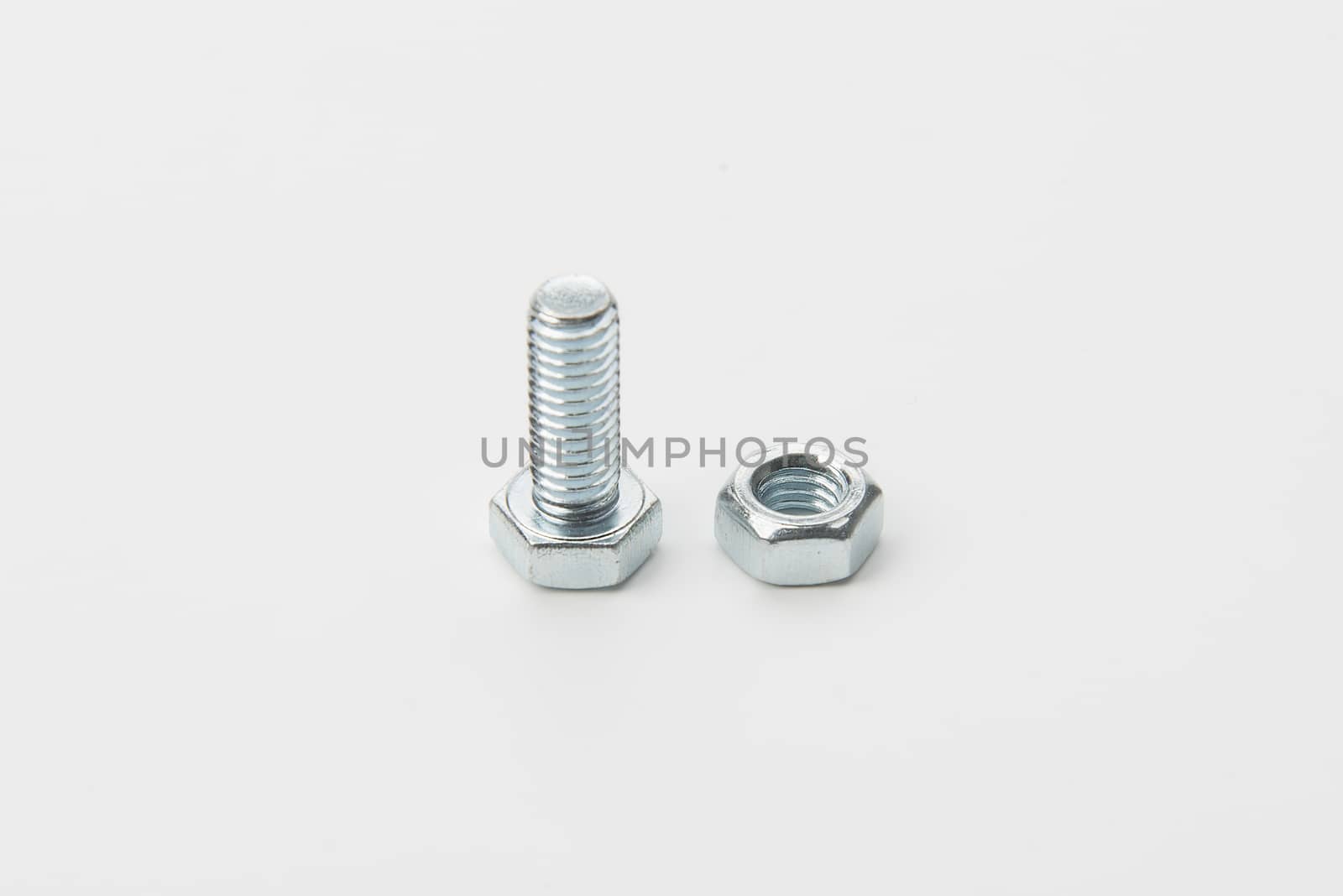 a screw and a bolt in a white background