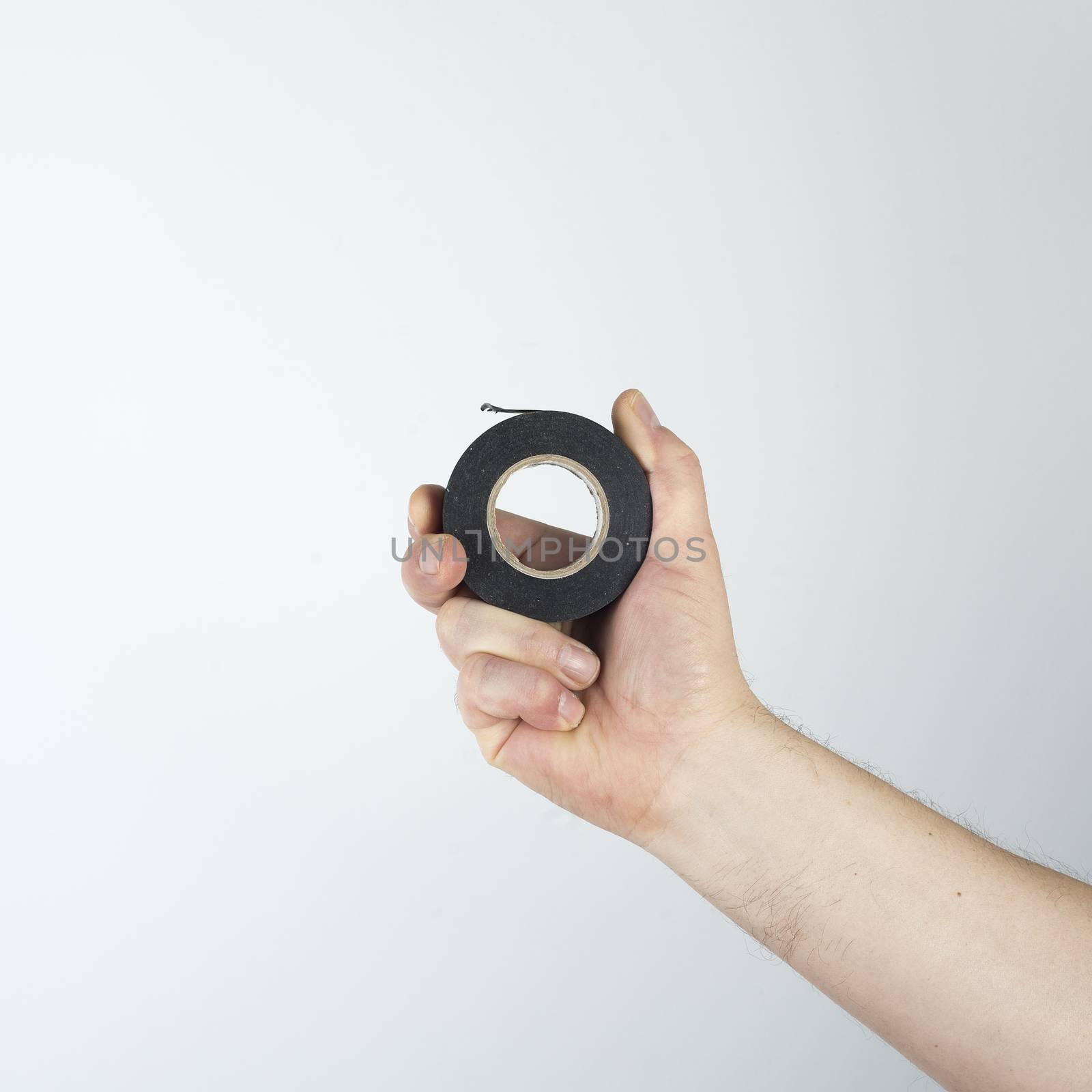 a roll of insulating tape in his hand