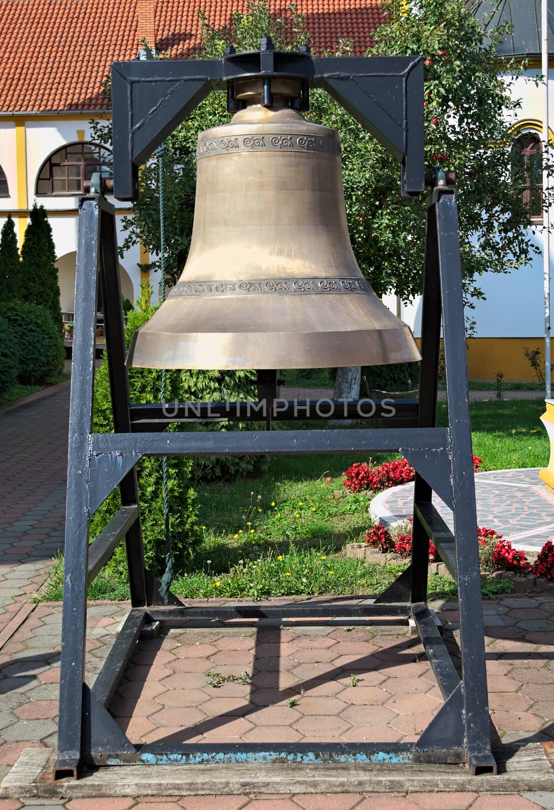 Big church bell in monastery garden, closeup