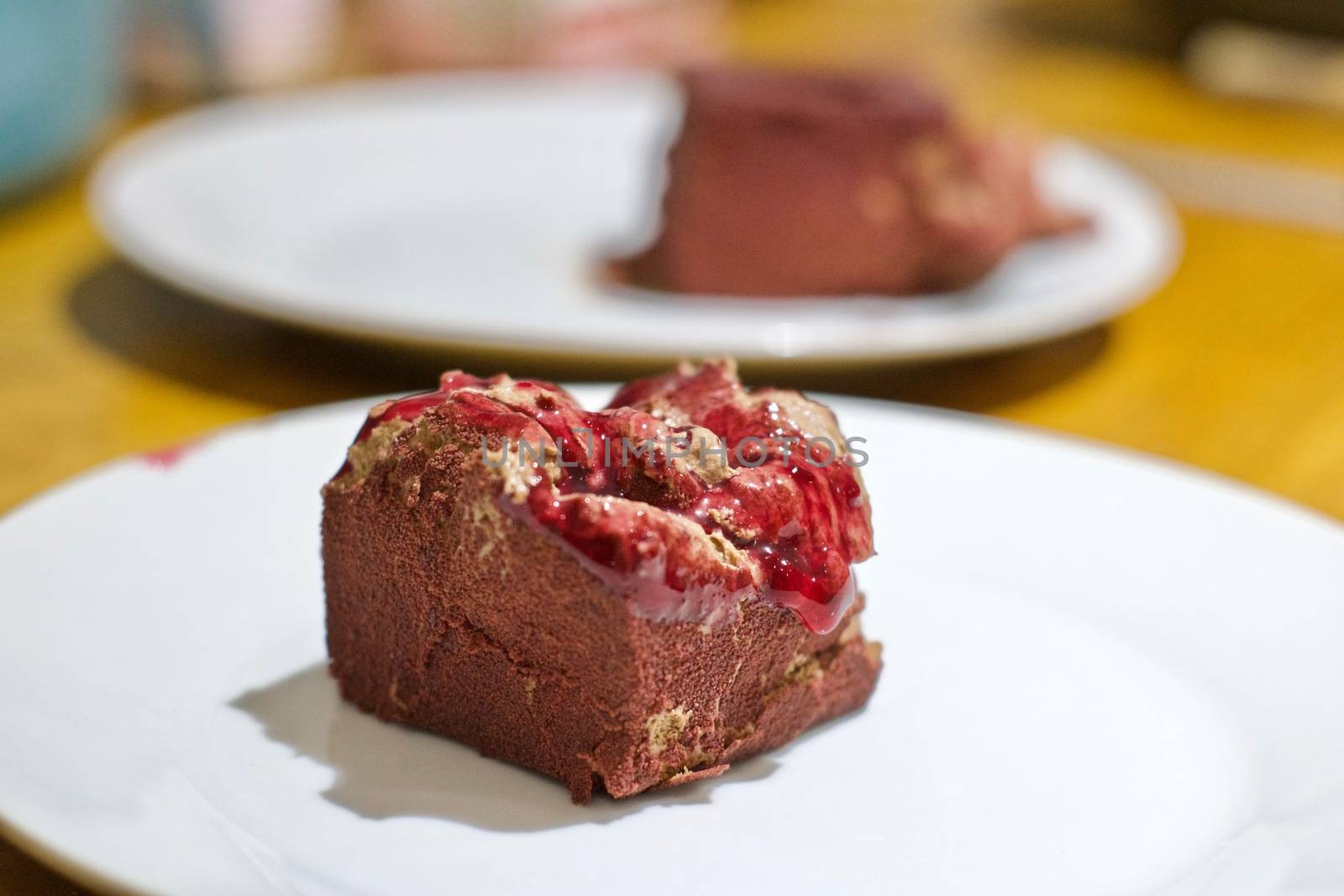 Delicious chocolate fresh and tasty cake with raspberry jam. Food concept.