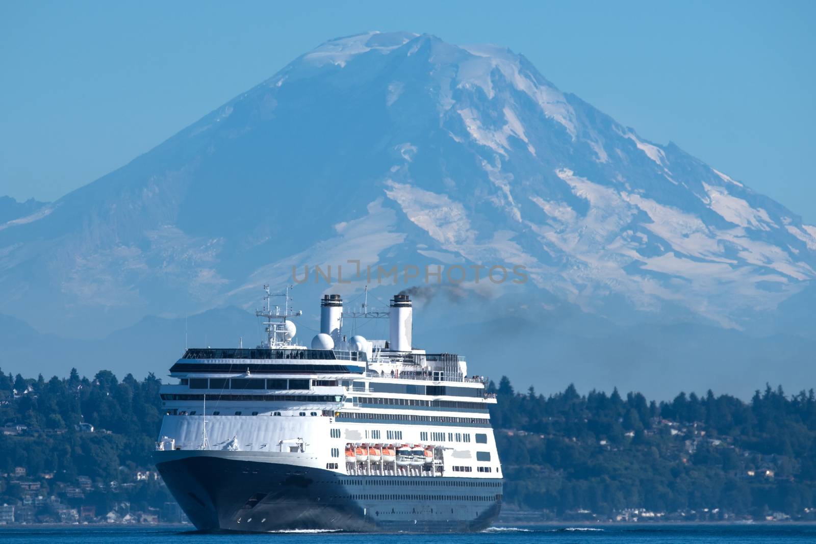 Holland America Line's M/V Amsterdam leaving Seattle on her way to Alaska with Mount Rainier in the background.