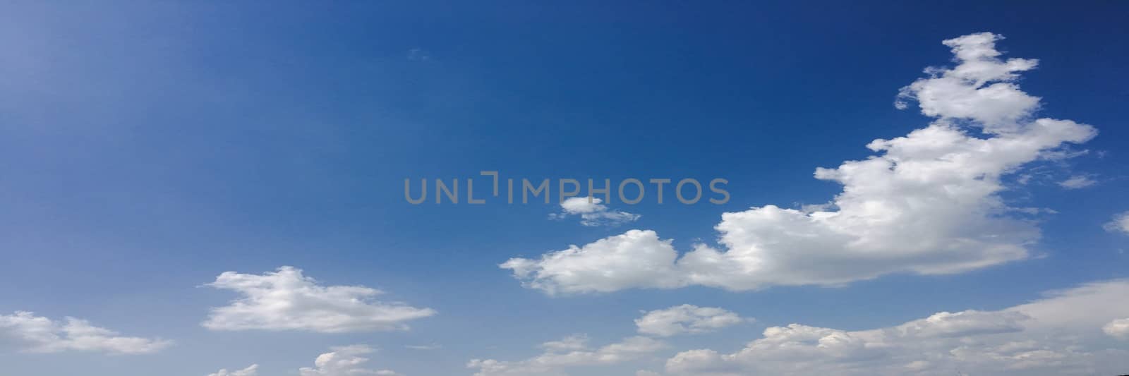 beautiful blue sky with clouds background.Sky with clouds weather nature cloud blue.Blue sky with clouds and sun. by titco