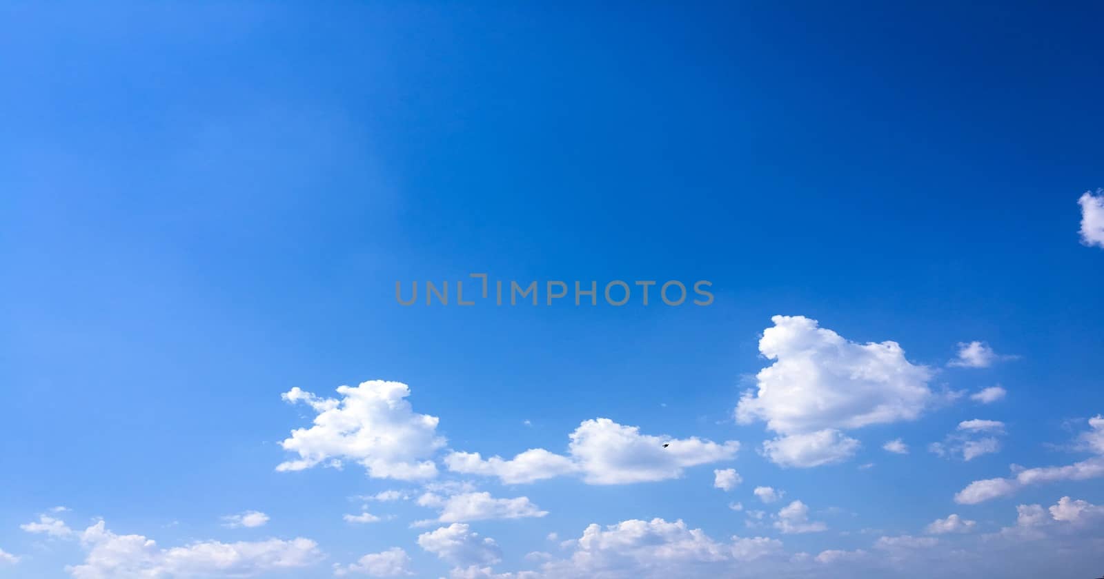 beautiful blue sky with clouds background.Sky with clouds weather nature cloud blue.Blue sky with clouds and sun. by titco