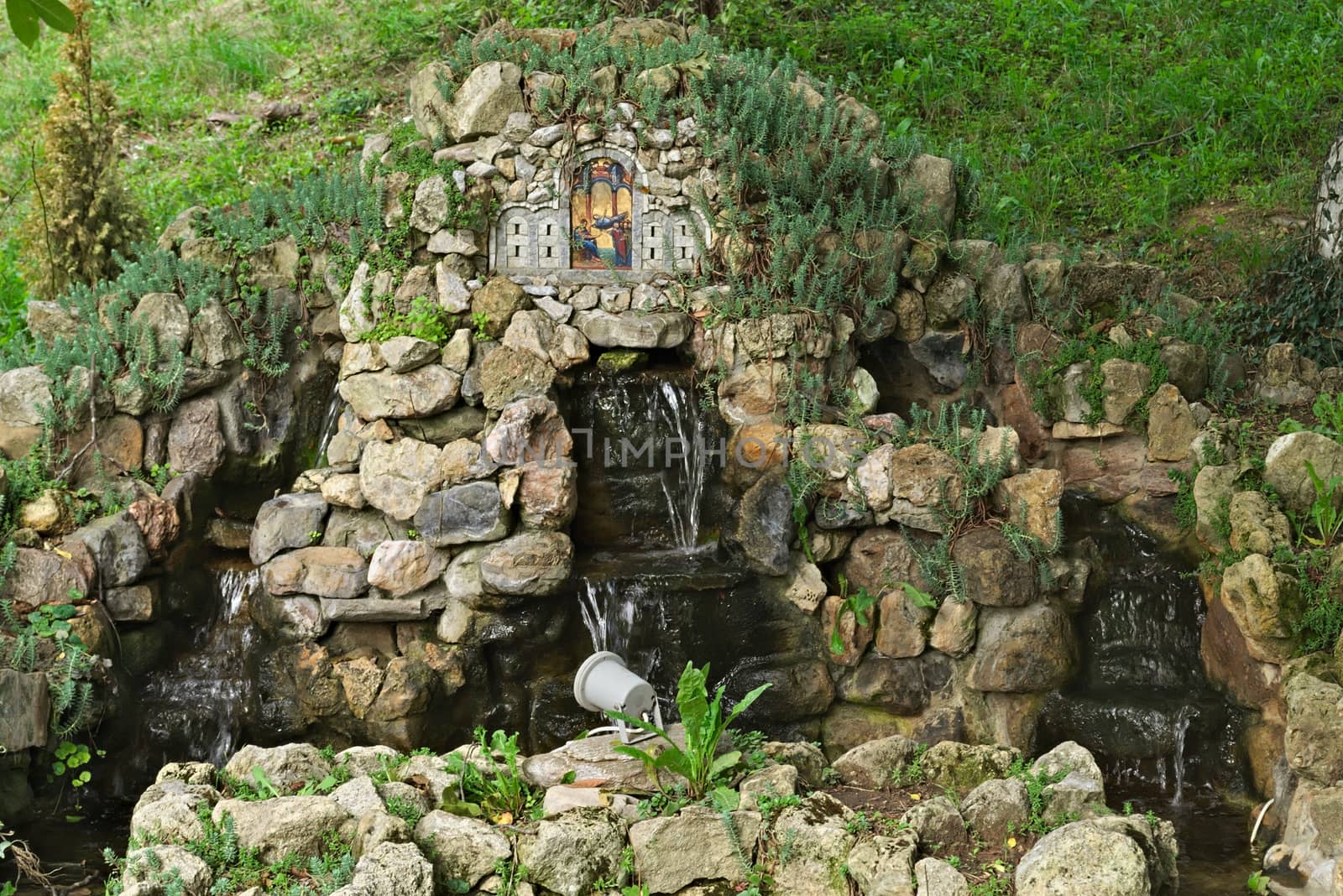 Small fountain in park, surrounded by trees by sheriffkule