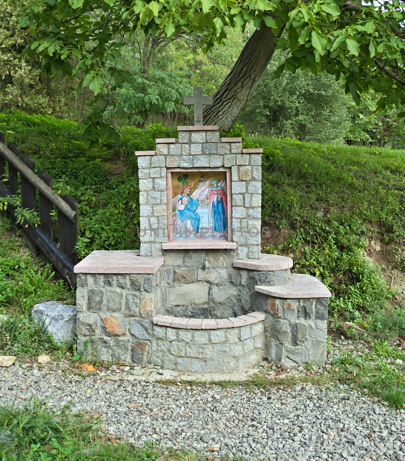 Small fountain with religious mosaic in monastery yard, Serbia