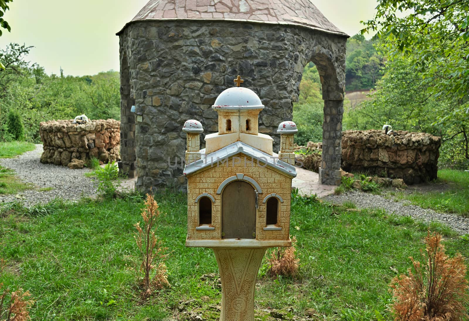 Model church, outdoor, behind stone chapel