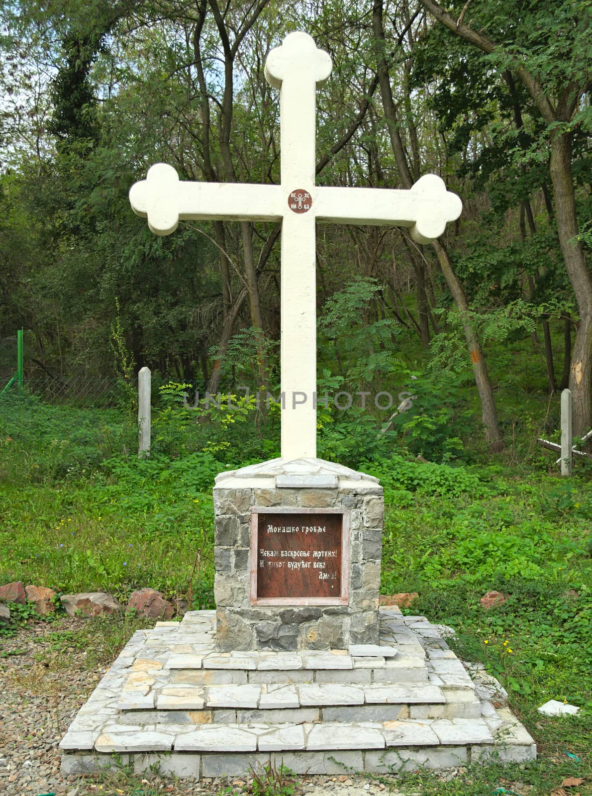 Stone cross monument, orthodox christian, in park by sheriffkule