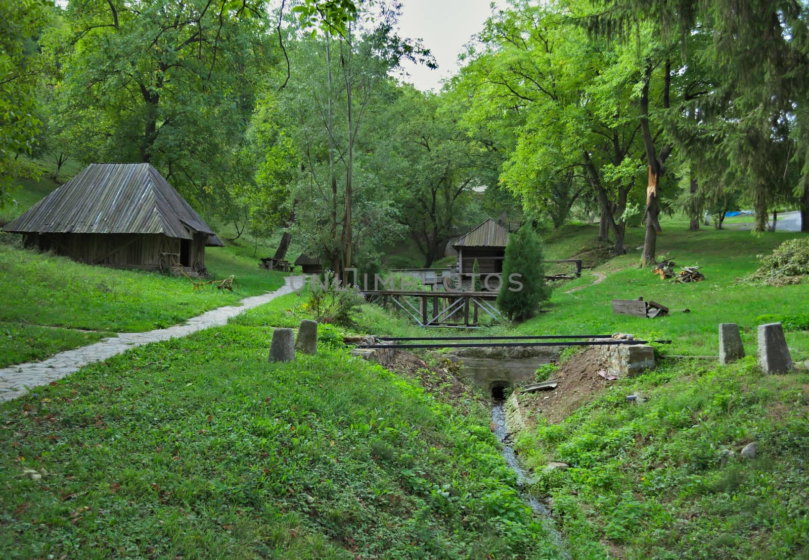 Landscape in etno park, with river, and old style houses