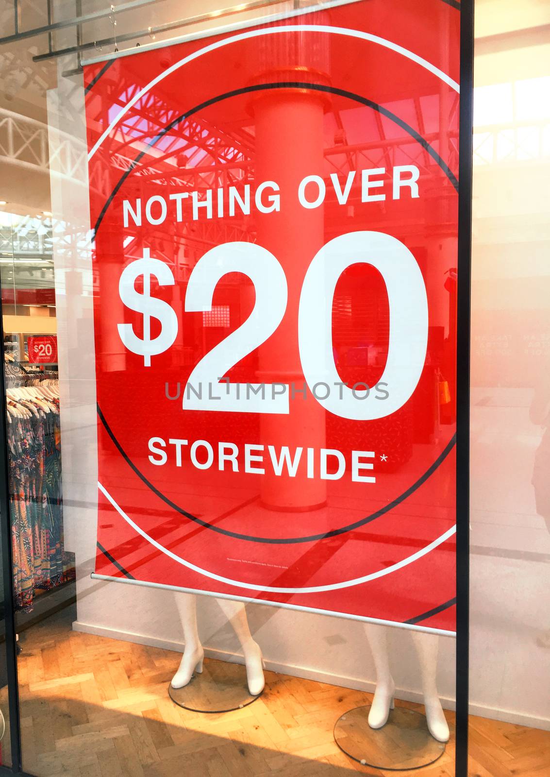 Store banner in shopfront advertises a sale with nothing over $20.00