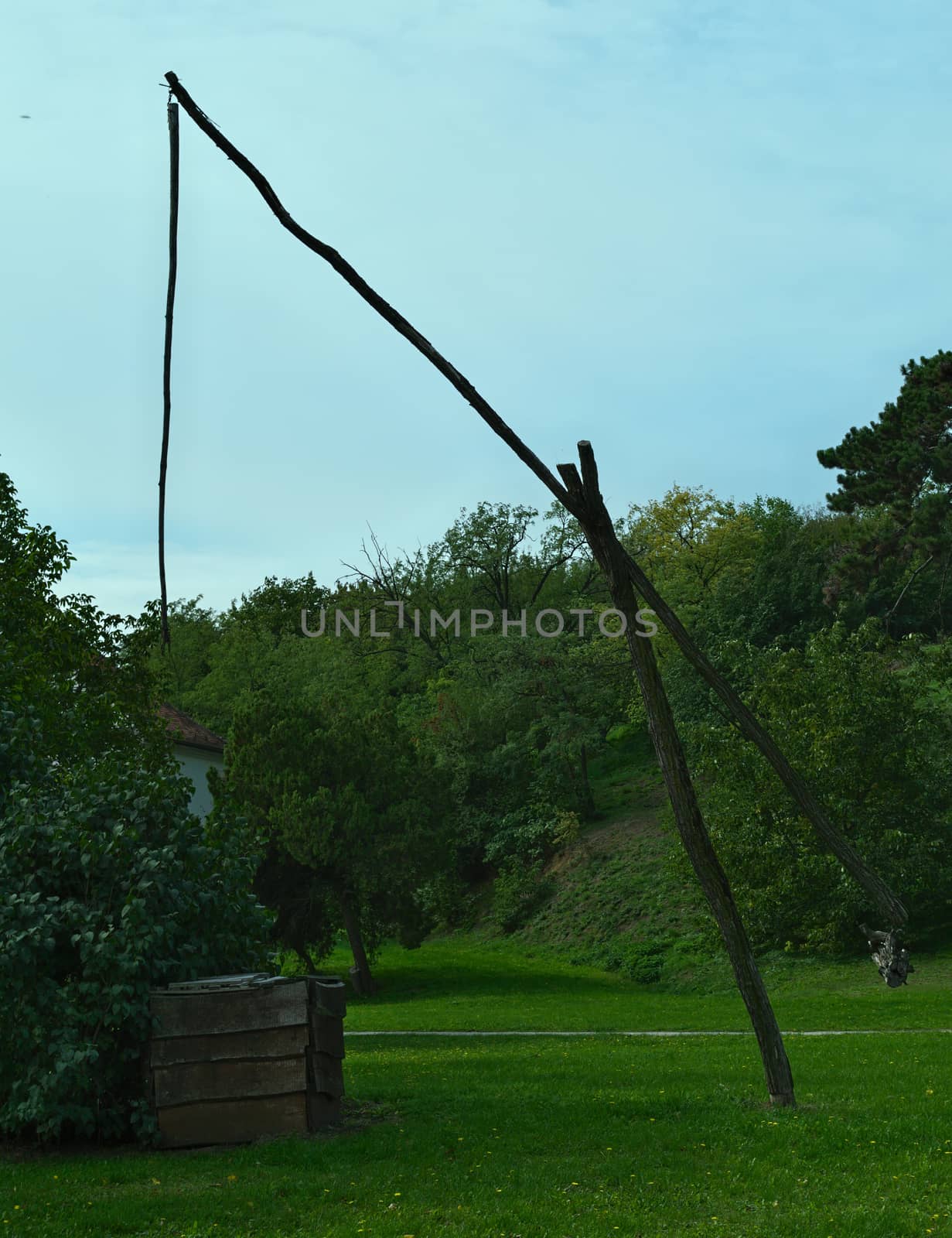 Old style water well in park by sheriffkule