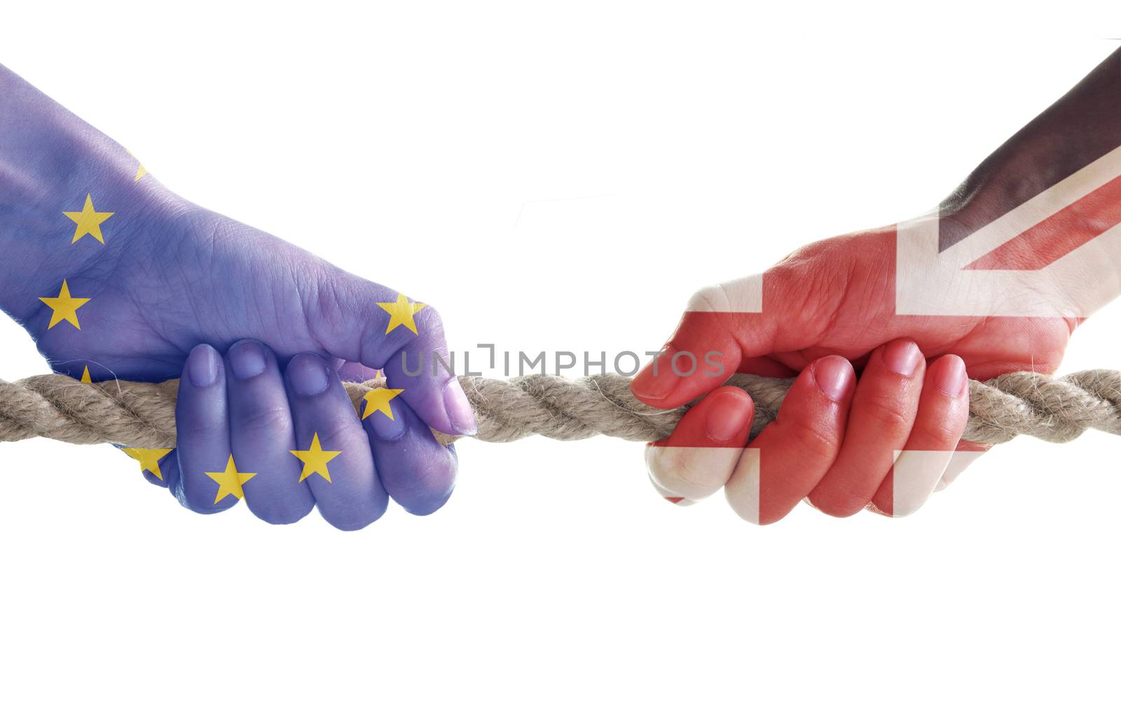 Tug of war between hands painted with UK and European flags 