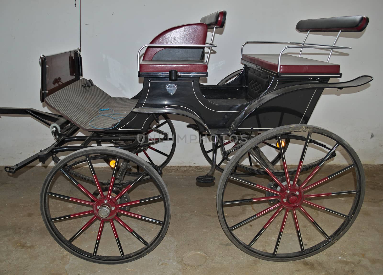 Vintage old style chariot in barn by sheriffkule