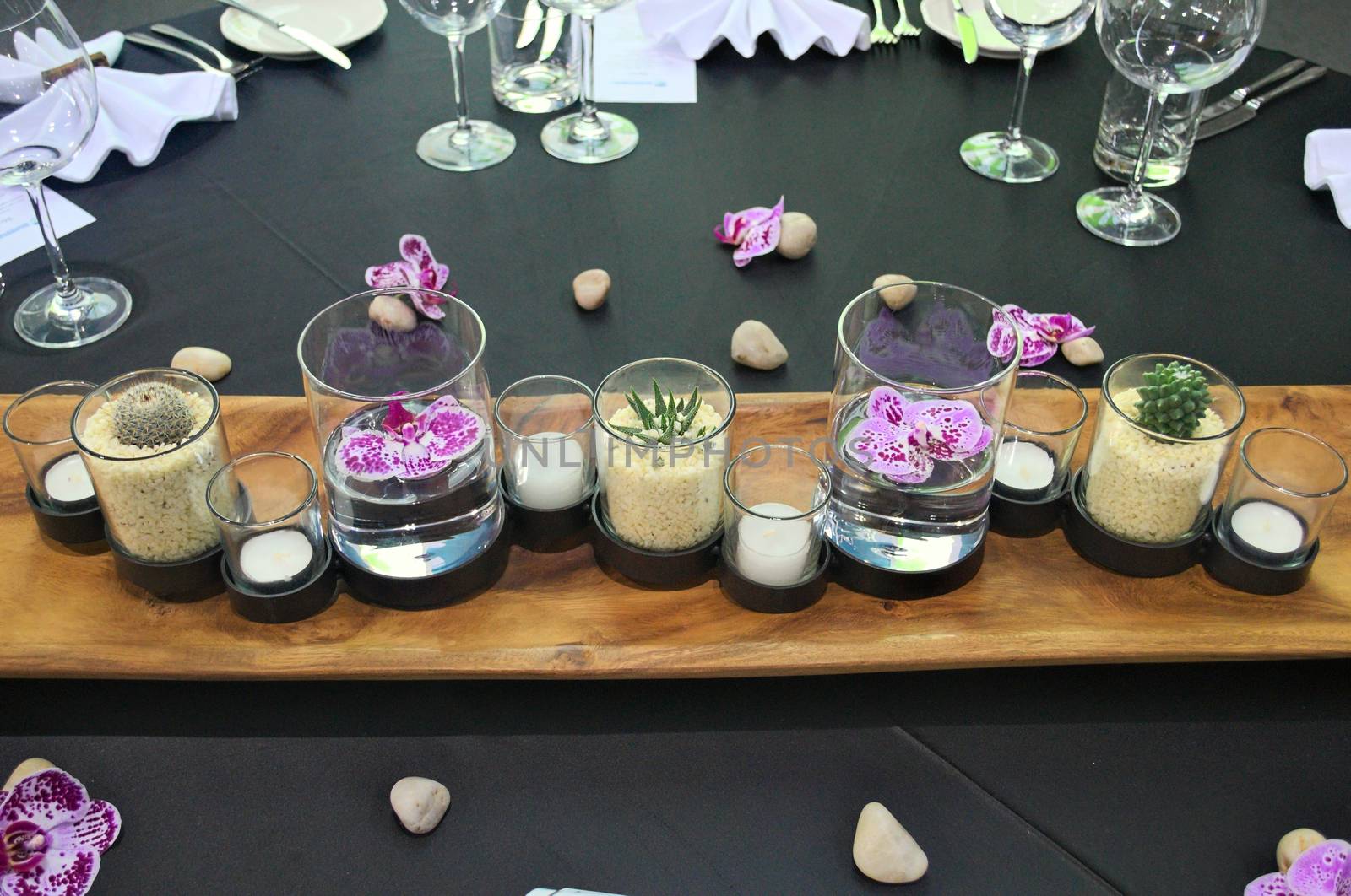 Elegant decorative arrangement with glasses on table