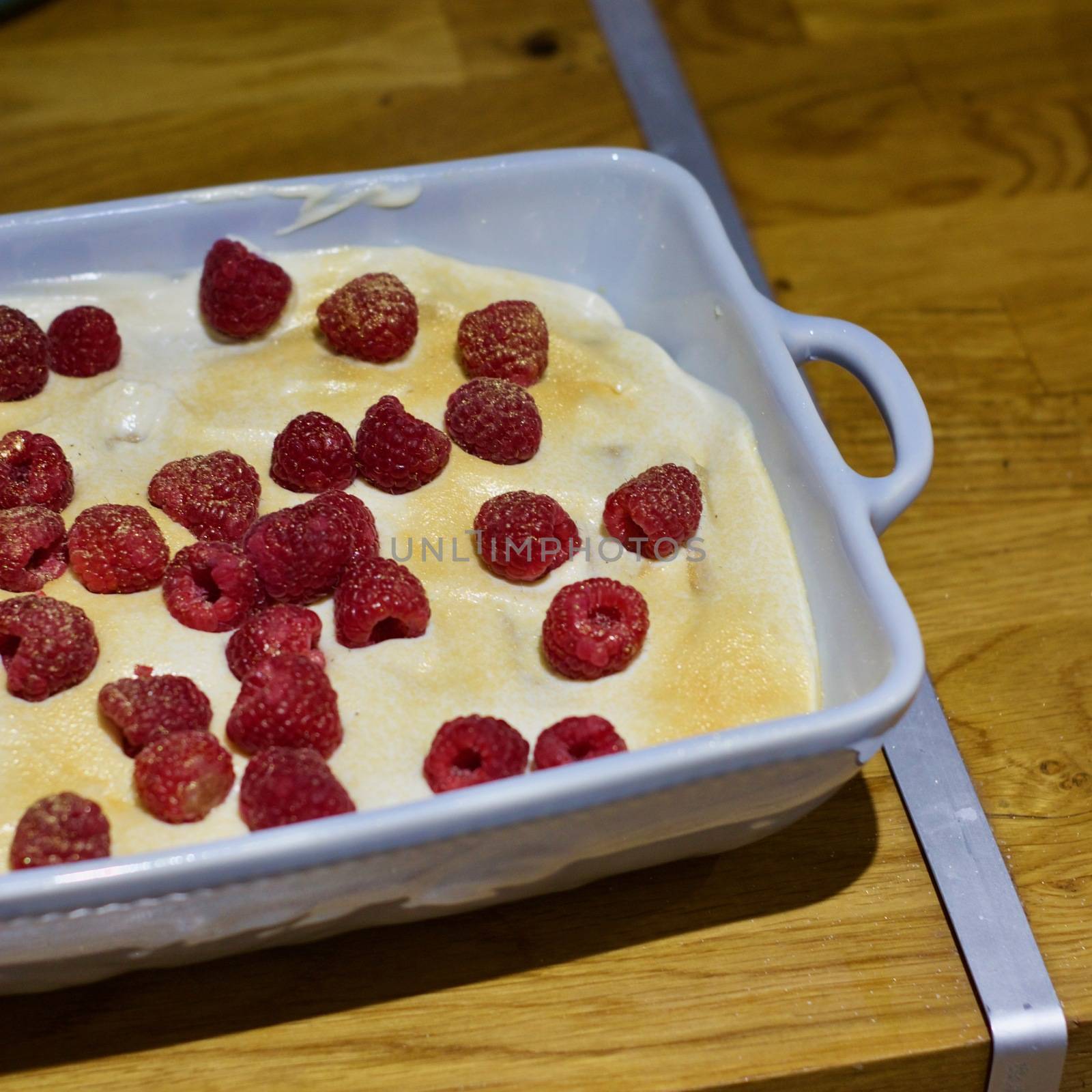 Delicious and fresh home made tiramisu with raspberry. Sweet food concept.