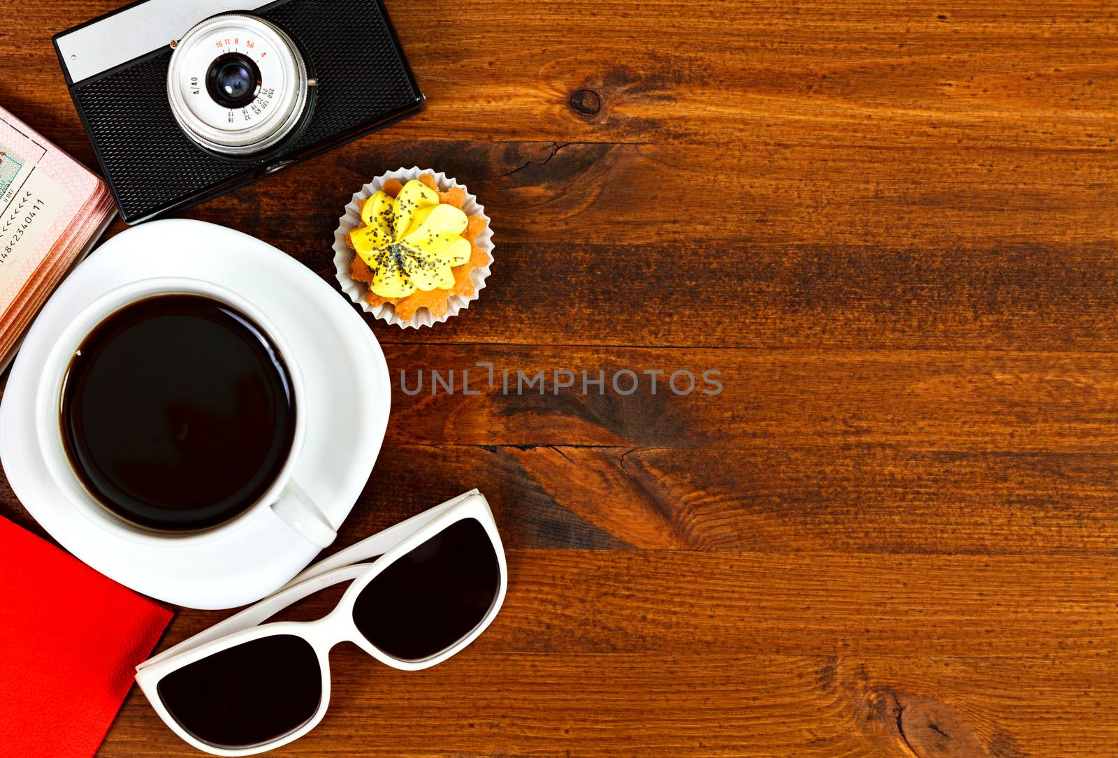 Retro photo camera, coffee cup, passport, sunglasses and cupcake by Nobilior