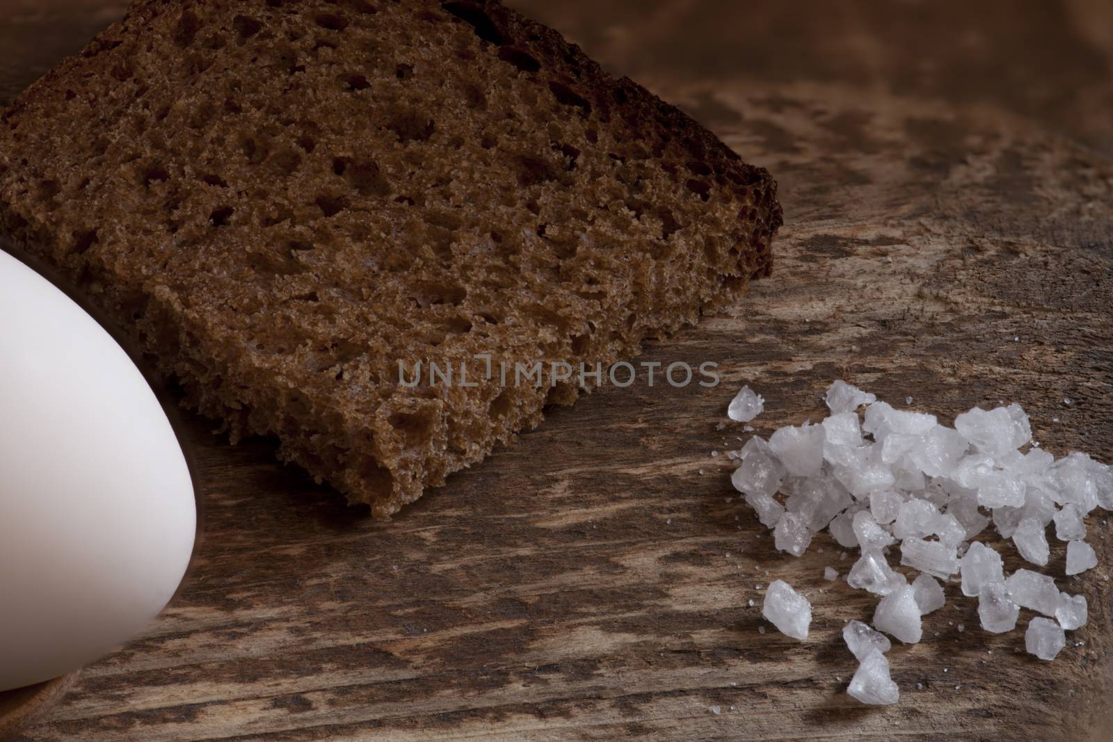 piece of coarse rye bread with salt and egg by mrivserg